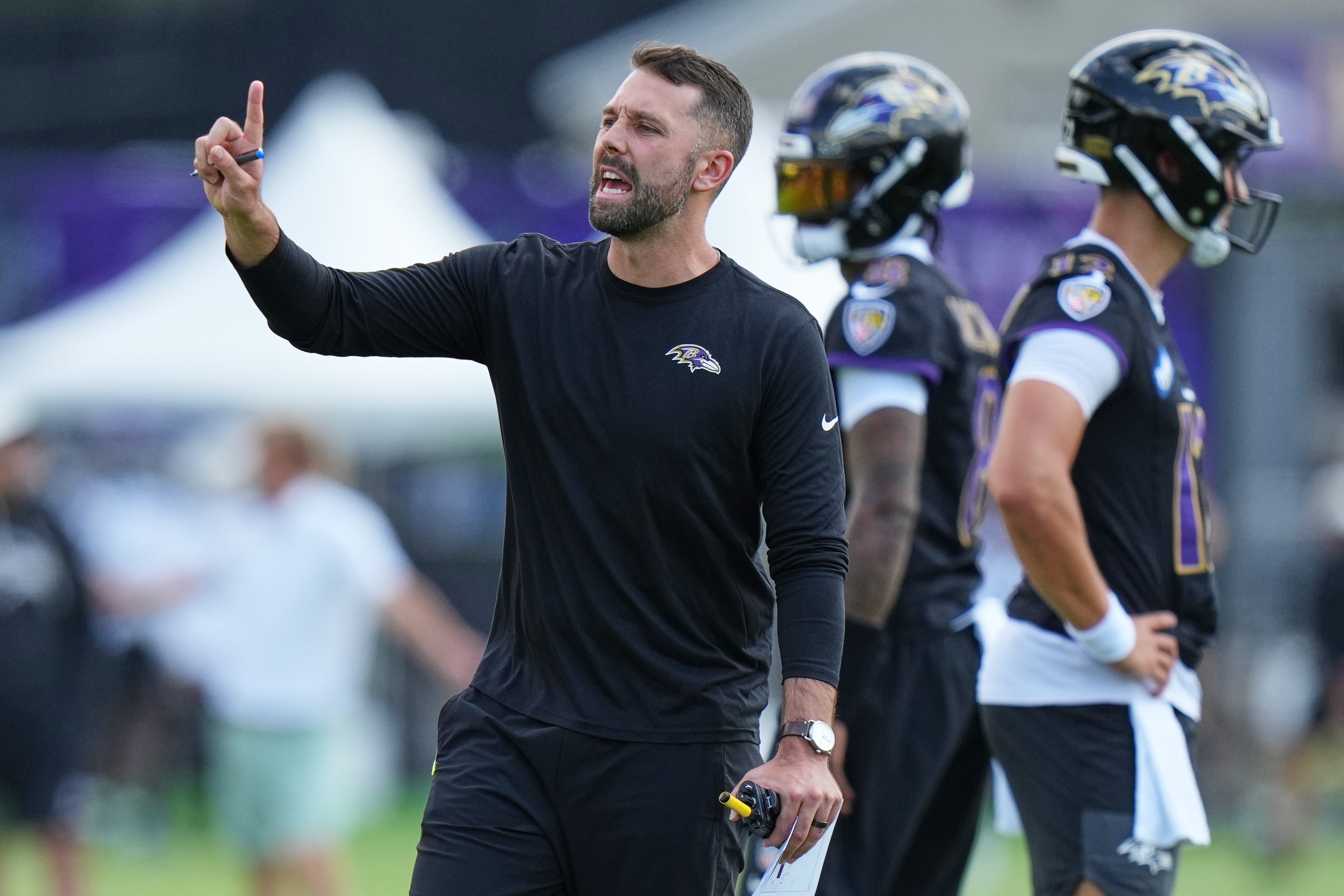 Baltimore Ravens offensive coordinator Declan Doyle coaches during practice at the team's NFL football training camp, Wednesday, July 29, 2026, at the Under Armour Performance Center in Owings Mills, Md.