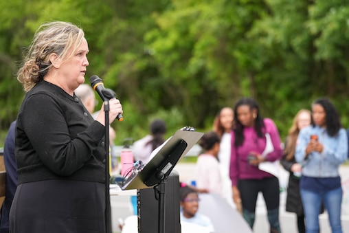 Howard County Councilwoman Liz Walsh gives remarks with the Stop Grace Coalition during a rally down the street from the W.R. Grace headquarters in Columbia, Md. on Thursday, May 14, 2026. The group is applying pressure on the county Board of Appeals to release a written decision on their rejection of the Stop Grace Coalition’s September 2025 complaint.