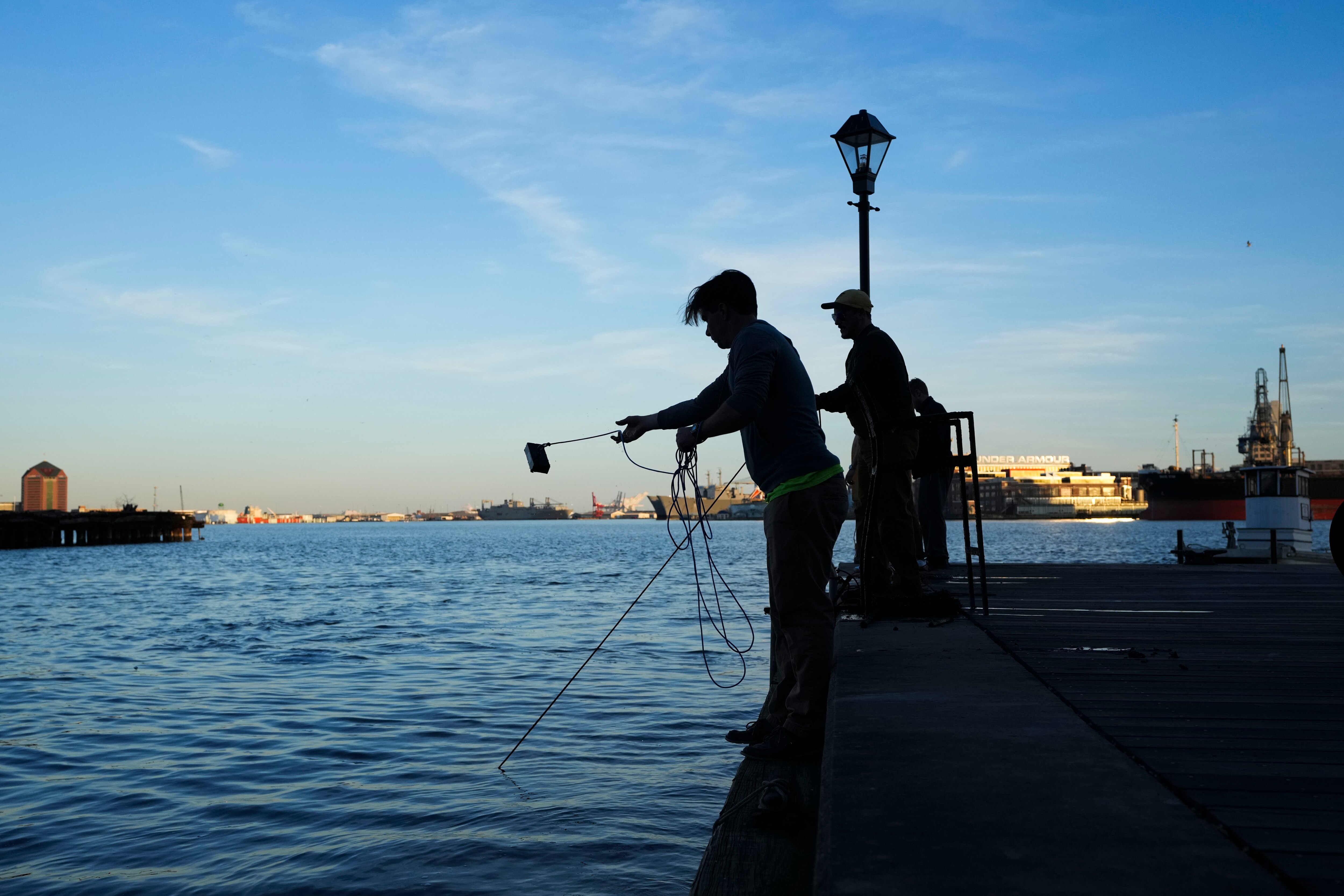 Jonathan Foster casts his magnet out into the water. The Salvage Art Magnet Fishing Meetup hosted a Saint Patrick's Day themed night where thirty plus people went treasure hunting in the harbor on March 16, 2023.