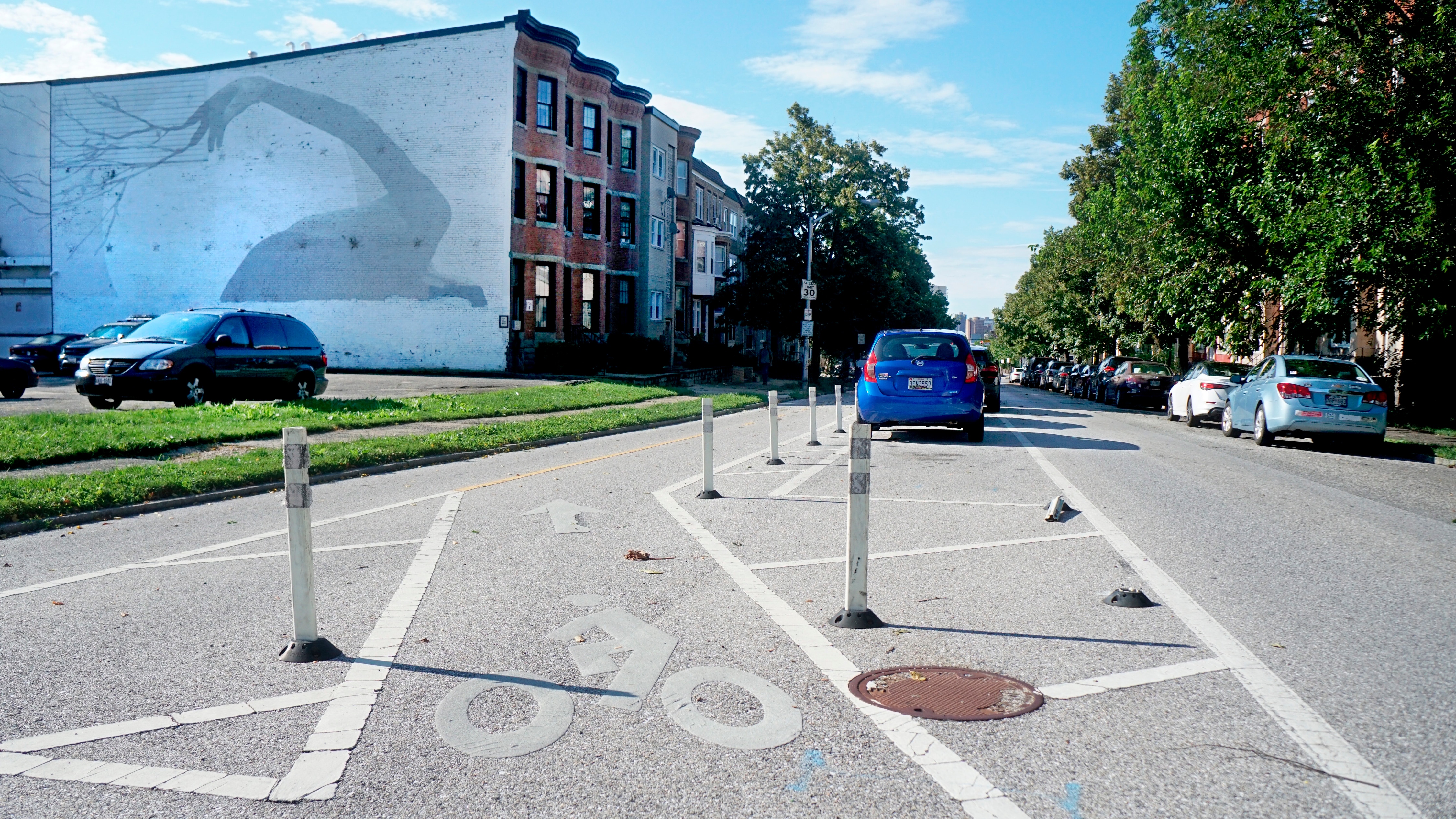 Baltimore’s 2017 bike plan addendum called for 77 additional miles of separated bicycle lanes, like this one that runs north-south along Maryland Avenue. But city reports and cyclist estimates pin the total for five years of construction at just over 7 miles.