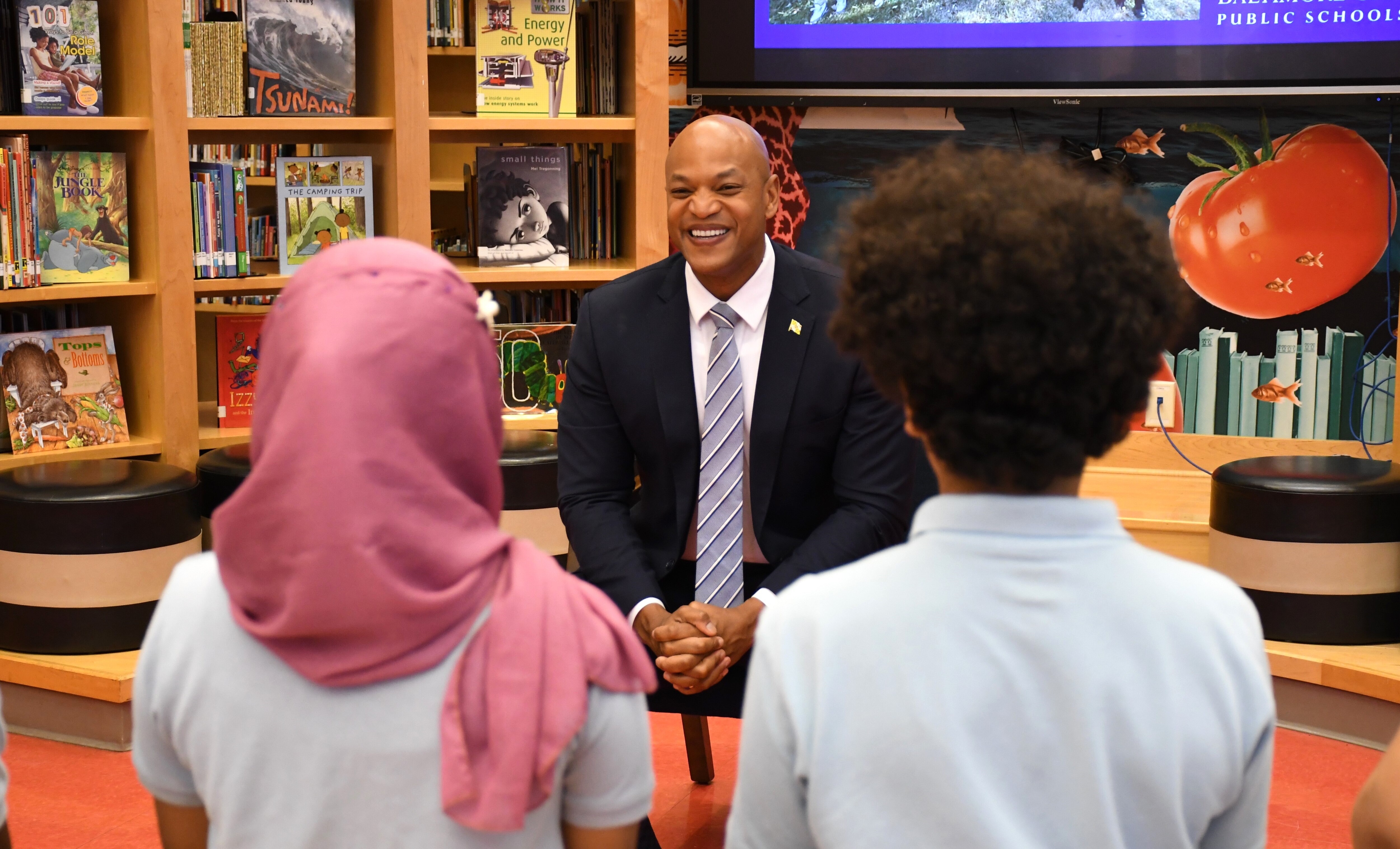 Maryland Gov. Wes Moore speaks with students on Tuesday, June 4, 2024 at Elmer A. Henderson: A Johns Hopkins Partnership School in East Baltimore. He visited the school to sign an executive order on climate change.