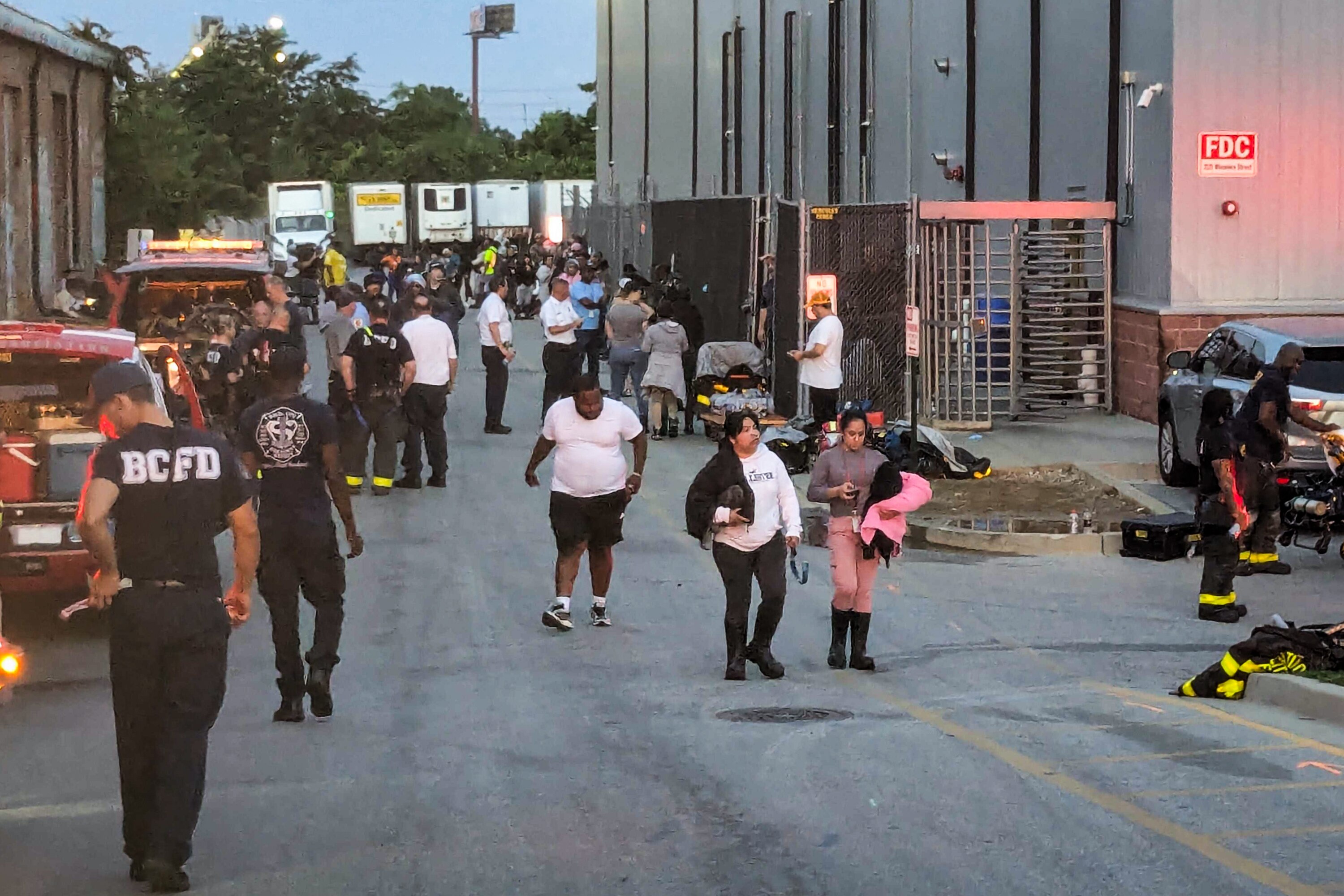 First responders working the scene at a HAZMAT incident at Holly Poultry, a poultry processing plant in Southwest Baltimore on Sunday July 27, 2025. Five people were hospitalized and five more were treated at the scene. A fire department spokesperson said dangerously high levels of carbon dioxide were found inside the plant.