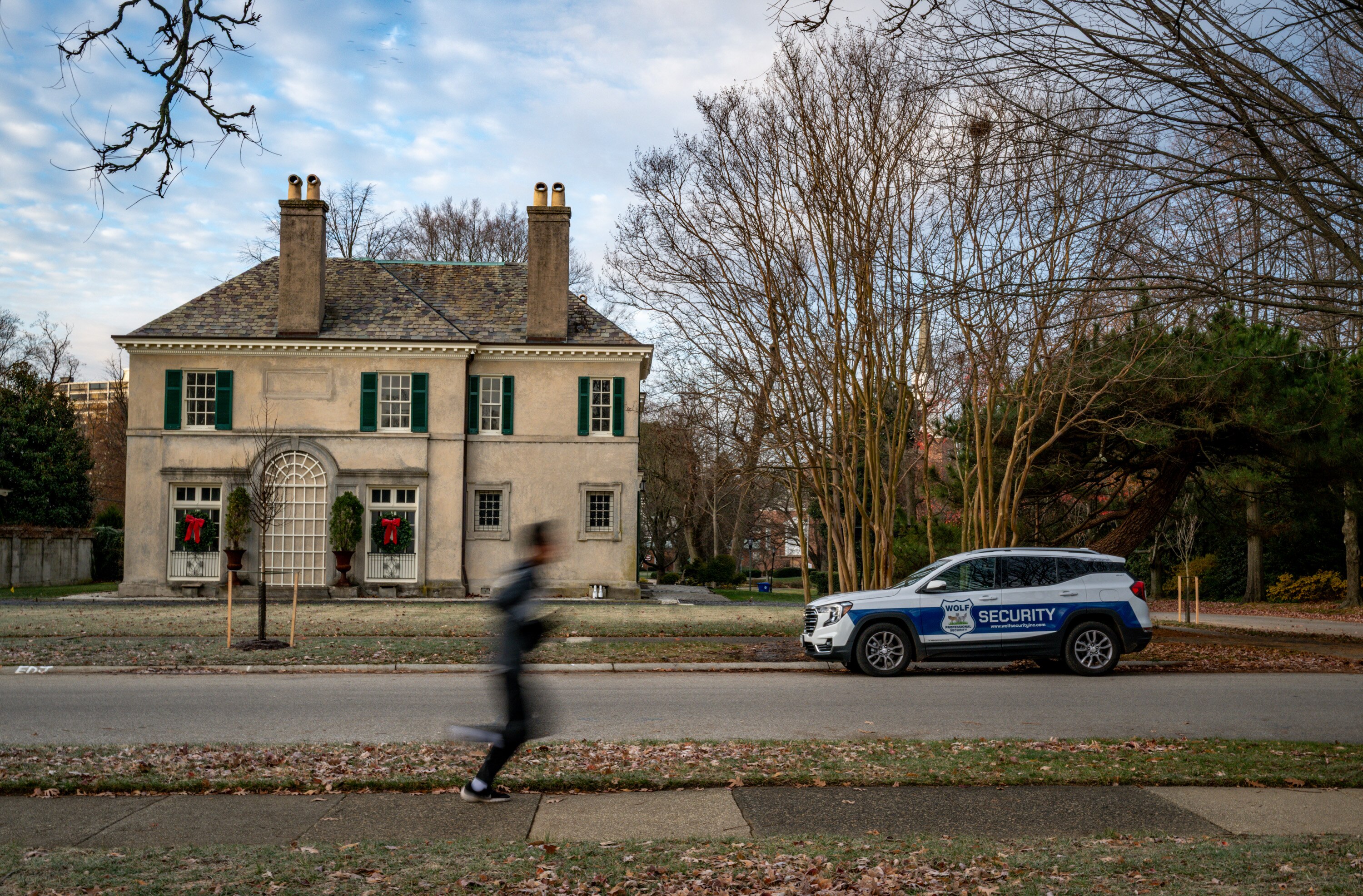 A private security vehicle is parked along Greenway following a series of carjackings of delivery drivers in the Guilford neighborhood. 