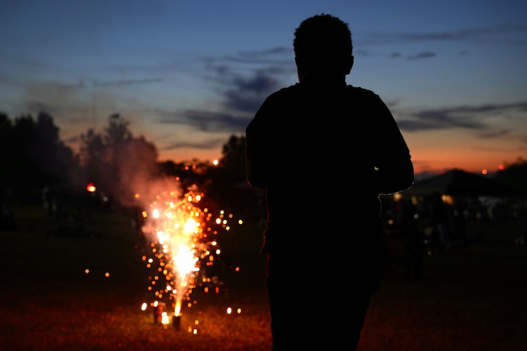 7/4/22—A young child watches fireworks and sparklers ignite at the Cherry Hill Arts & Music Waterfront Festival.