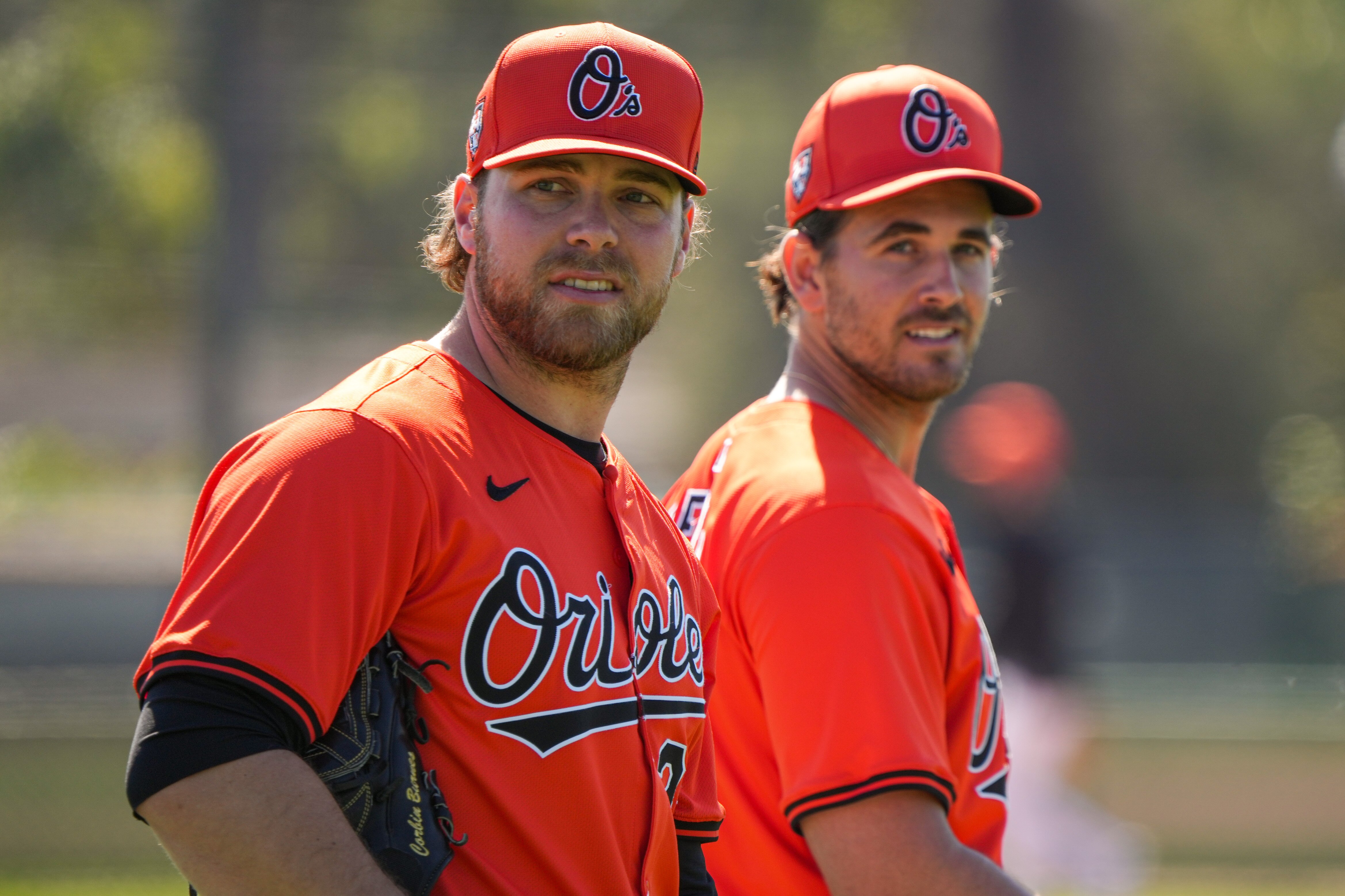 “It was definitely interesting to watch him on a day-to-day basis because he did things a little different than we were used to,” pitcher Dean Kremer, right, said of former ace Corbin Burnes, left.