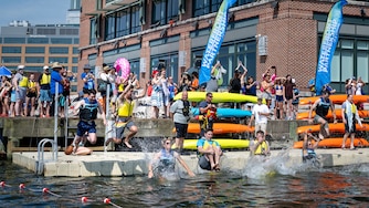 Baltimore Banner Giacomo "Jack" Bologna jumps into the Baltimore Harbor alongside other participants as a part of the Waterfront Partnership's Harbor Splash 2024 event held on 6/23/24 in Baltimore, MD.