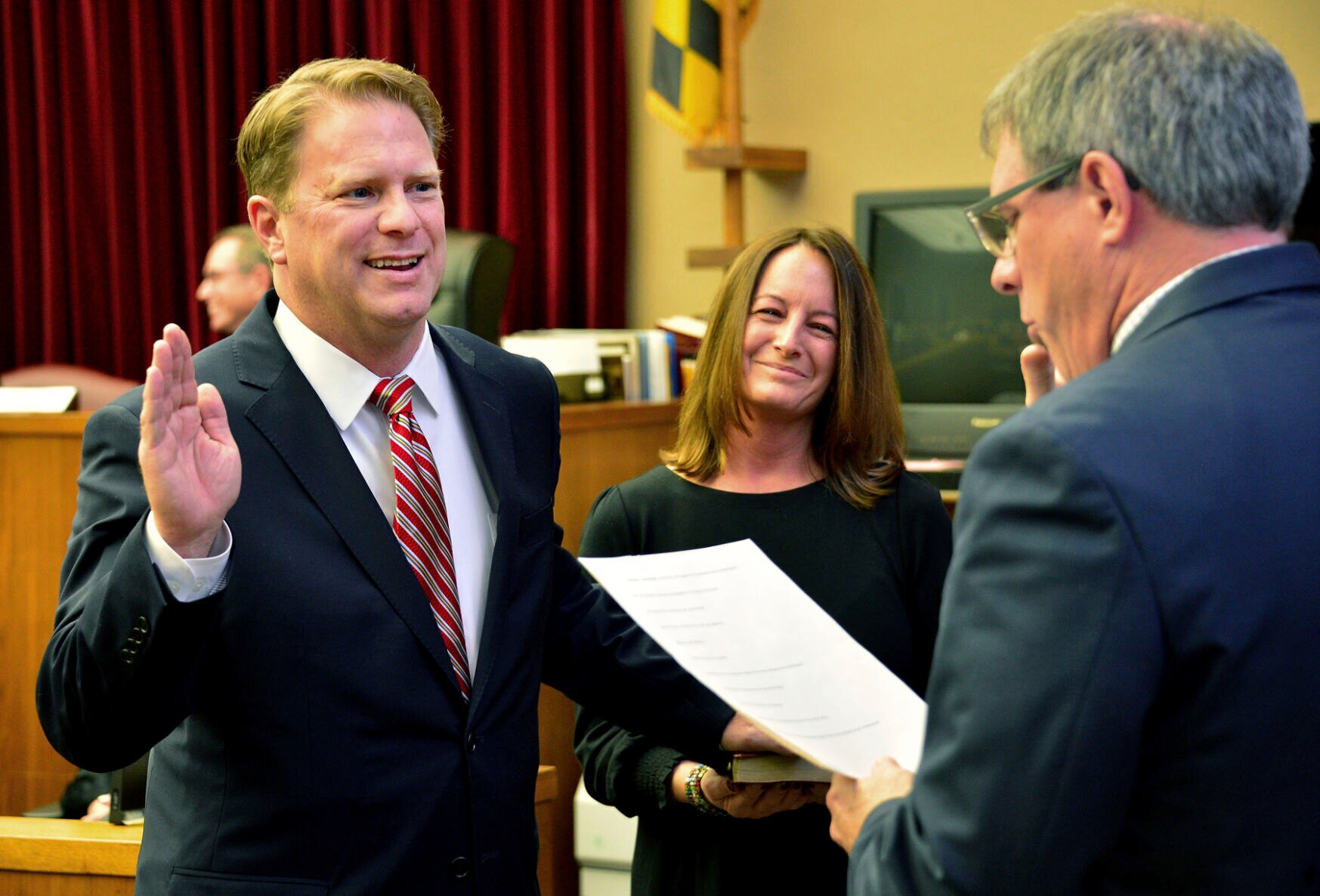 FILE - Washington County Circuit Court Clerk Kevin Tucker, right, swears in Andrew F. Wilkinson as a circuit court judge on Jan. 10, 2020, as Wilkinson's wife, Stephanie, watches.   Pedro Argote, 49, is suspected of gunning down the judge in his driveway hours after he ruled against him in a divorce case. The Washington County Sheriff's Office said in a statement   that the silver Mercedes SUV that Argote was believed to be driving has been located in Williamsport, about 8 miles (13 kilometers) southwest of Hagerstown, where the judge was shot outside his home. ( Julie E. Greene/The Herald-Mail via AP)