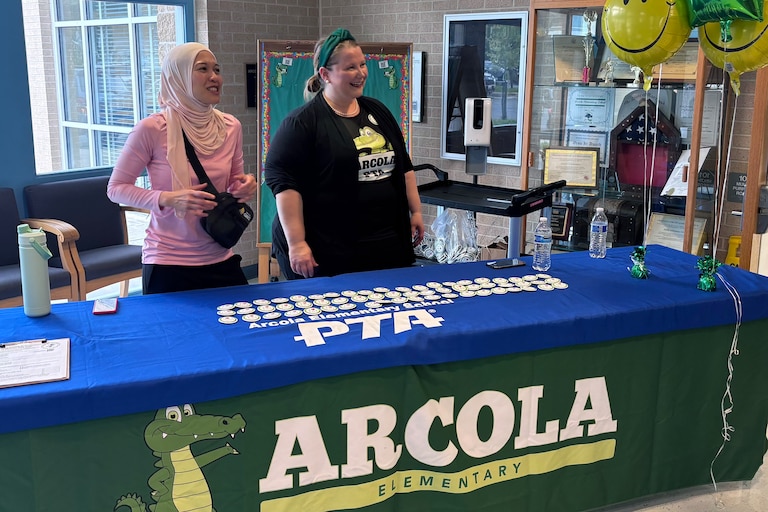 JULY 7, 2025 - Arcola Elementary parents Natalie LaLonde and Shahirah Mahmood greet families on Transition Day in July 2025. Photo taken at Arcola Elementary in Silver Spring.
