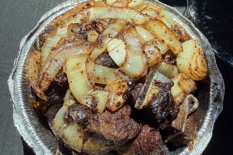 Koité Grill in College Park, pictured here, and Silver Spring fires up chunks of lamb using the namesake family’s recipes from Senegal. The tender, bone-in cuts are served with broken rice and thick, charred ribbons of sweet onions.