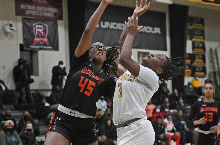 McDonogh's Kennedy Umeh (left), an all-around superstar, displays her defensive prowess in a contest against St. Frances last season.