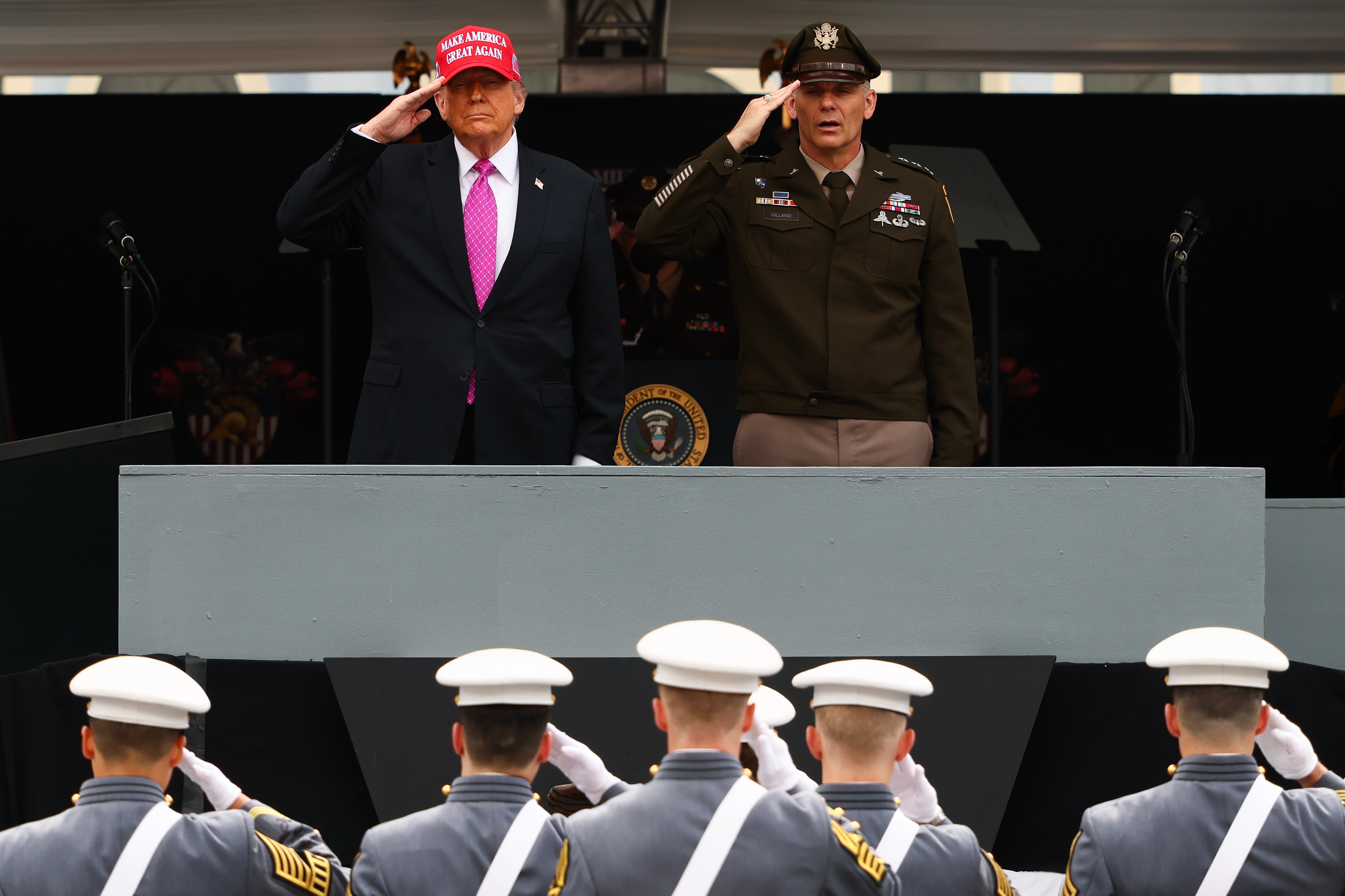 WEST POINT, NEW YORK - MAY 24: President Donald Trump and superintendent Lieutenant General Steven W. Gilland salute graduates of the United States Military Academy at West Point in Michie Stadium on Saturday May 24, 2025 in West Point, NY. Over one thousand cadets are expected to graduate in the same year that the U.S. Army celebrates its 250th birthday. This year's graduating class included honorary member Peter Wang, a junior ROTC cadet who was killed in the 2018 mass shooting at Marjory Stoneman Douglas High School in Parkland, Florida. (Photo by Michael M. Santiago/Getty Images)