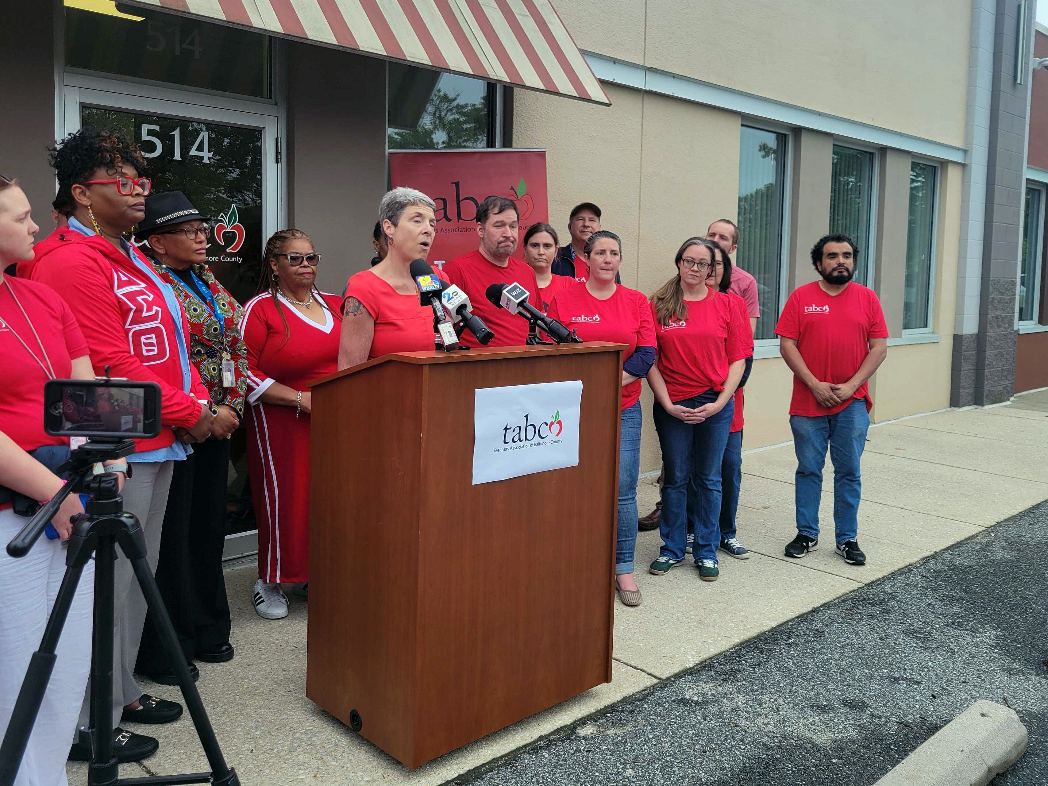 Cindy Sexton, head of the Teachers Association of Baltimore County, talks to reporters about having to renegotiate salary raises with Baltimore County Public Schools on May 14 outside the union's Towson headquarters.