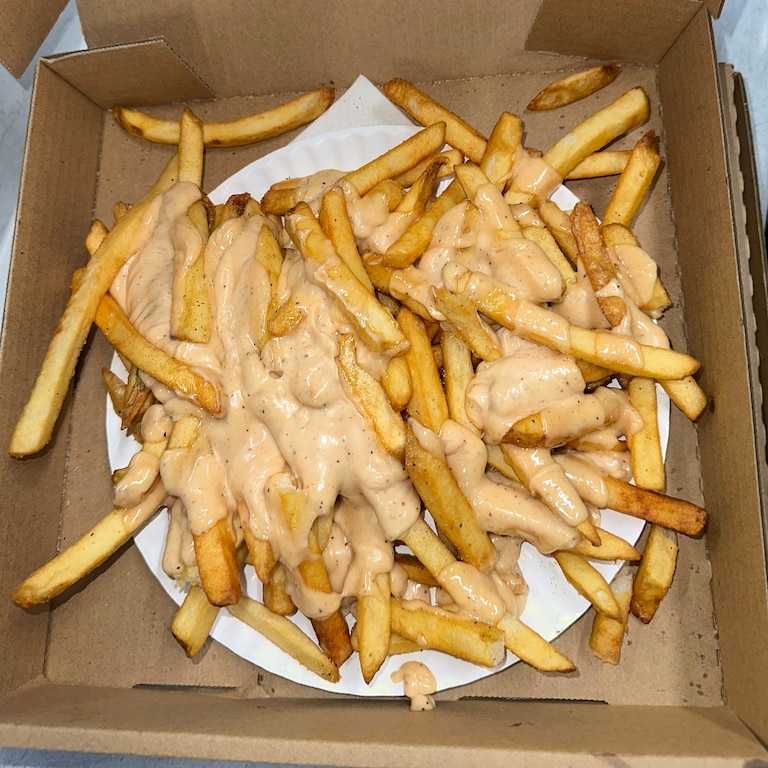 College Park’s Marathon Deli serves up fries drenched in Marathon sauce inside a pizza box.