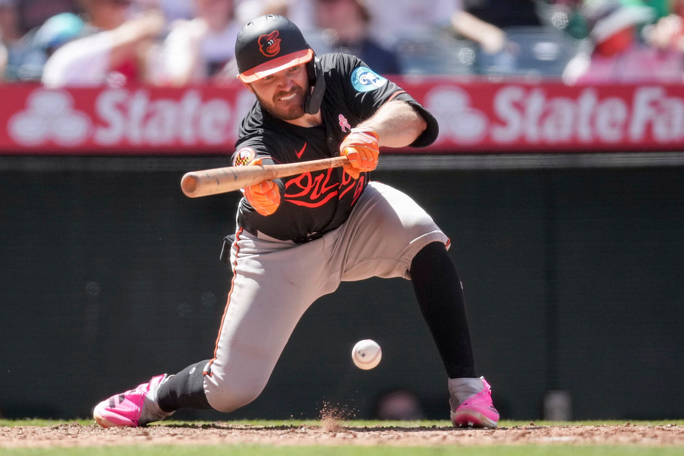 Orioles catcher Maverick Handley drives in a run with a bunt during the sixth inning Sunday in Anaheim.