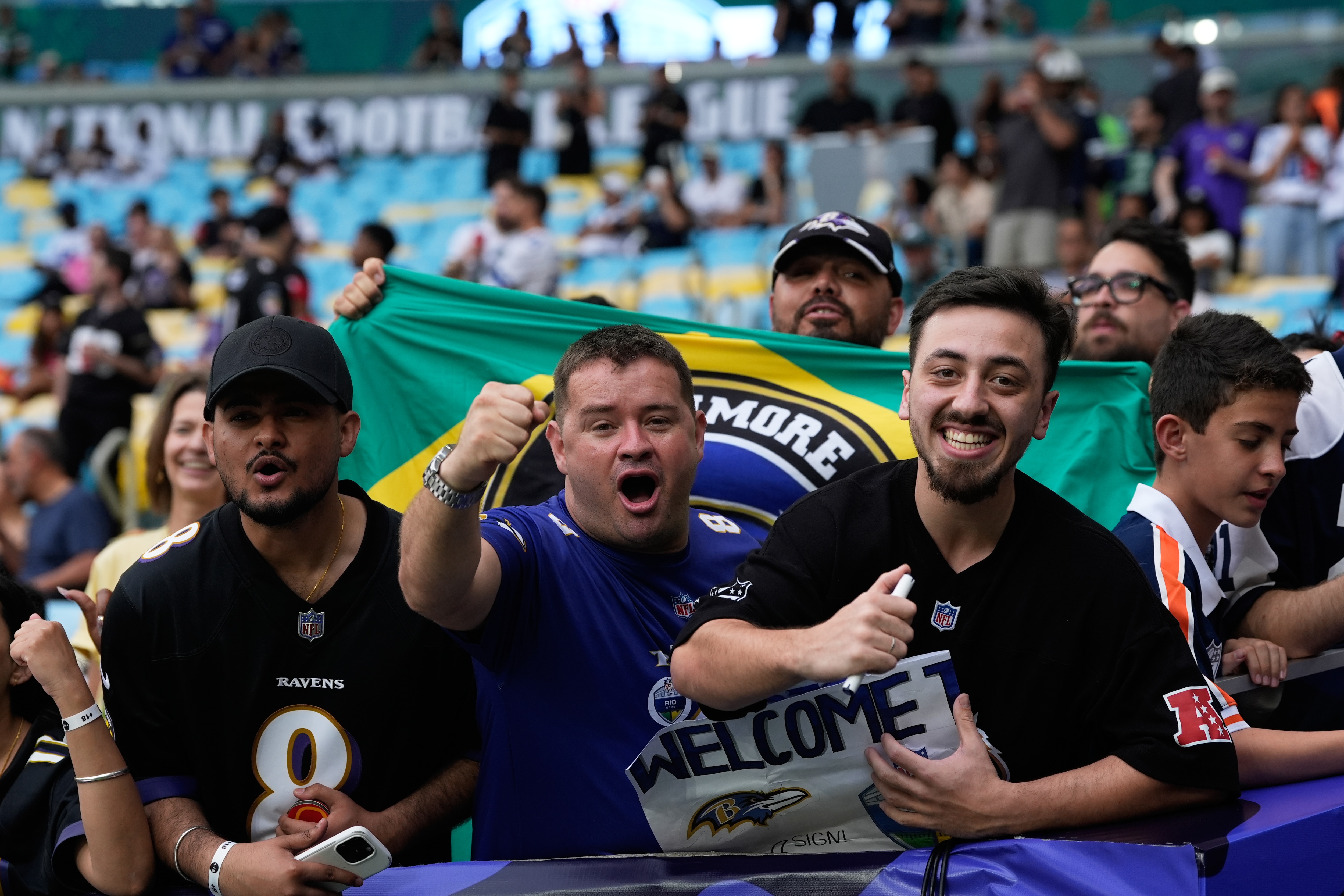 Baltimore Ravens fans cheer before an NFL football game against the Dallas Cowboys in Rio de Janeiro, Sunday, Sept. 27, 2026. (AP Photo/Fernando Llano)