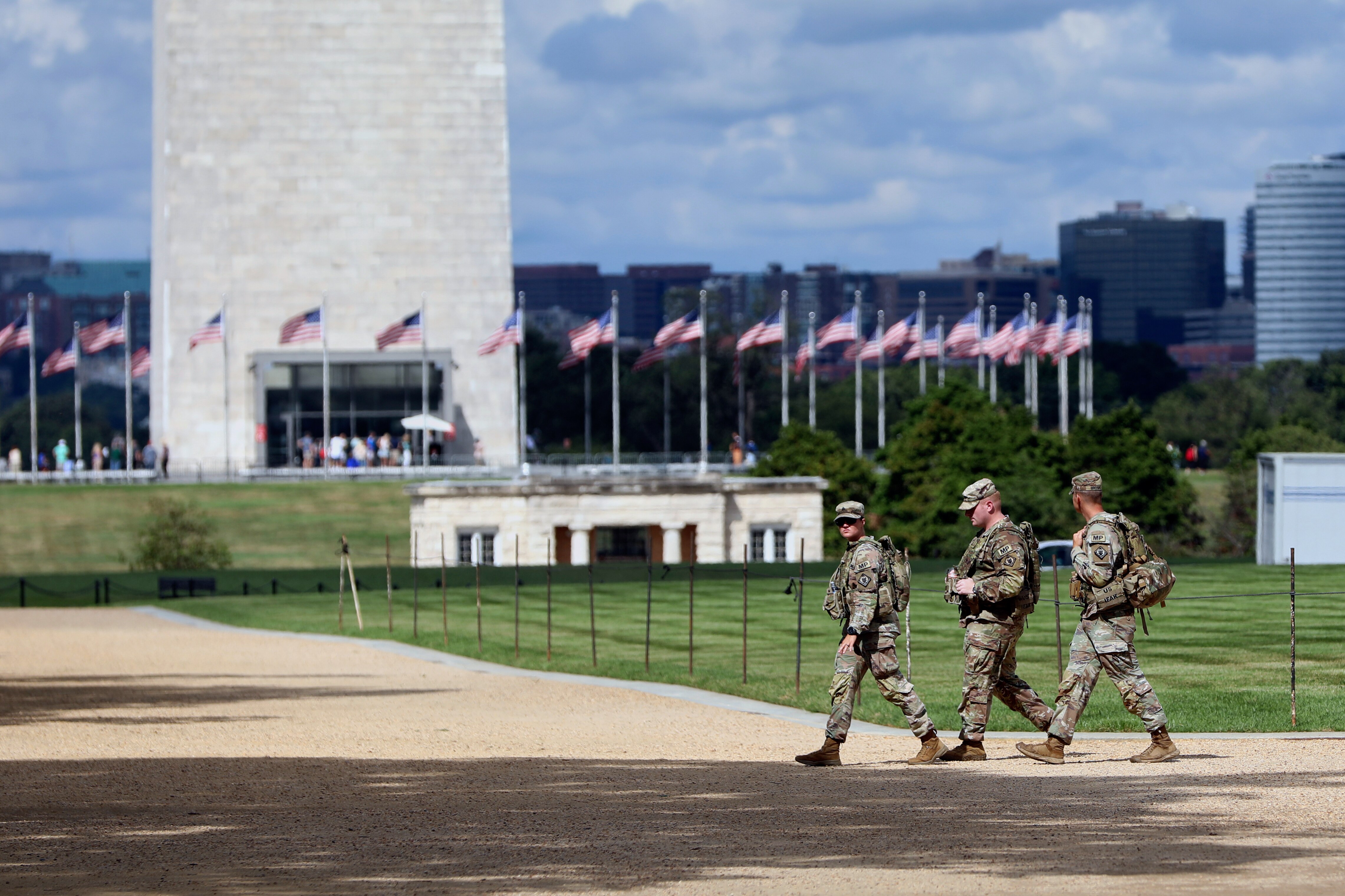 National Guardsmen patrol at the base of the Washington Monument, Friday, Aug. 22, 2025, in Washington. (AP Photo/Rahmat Gul)