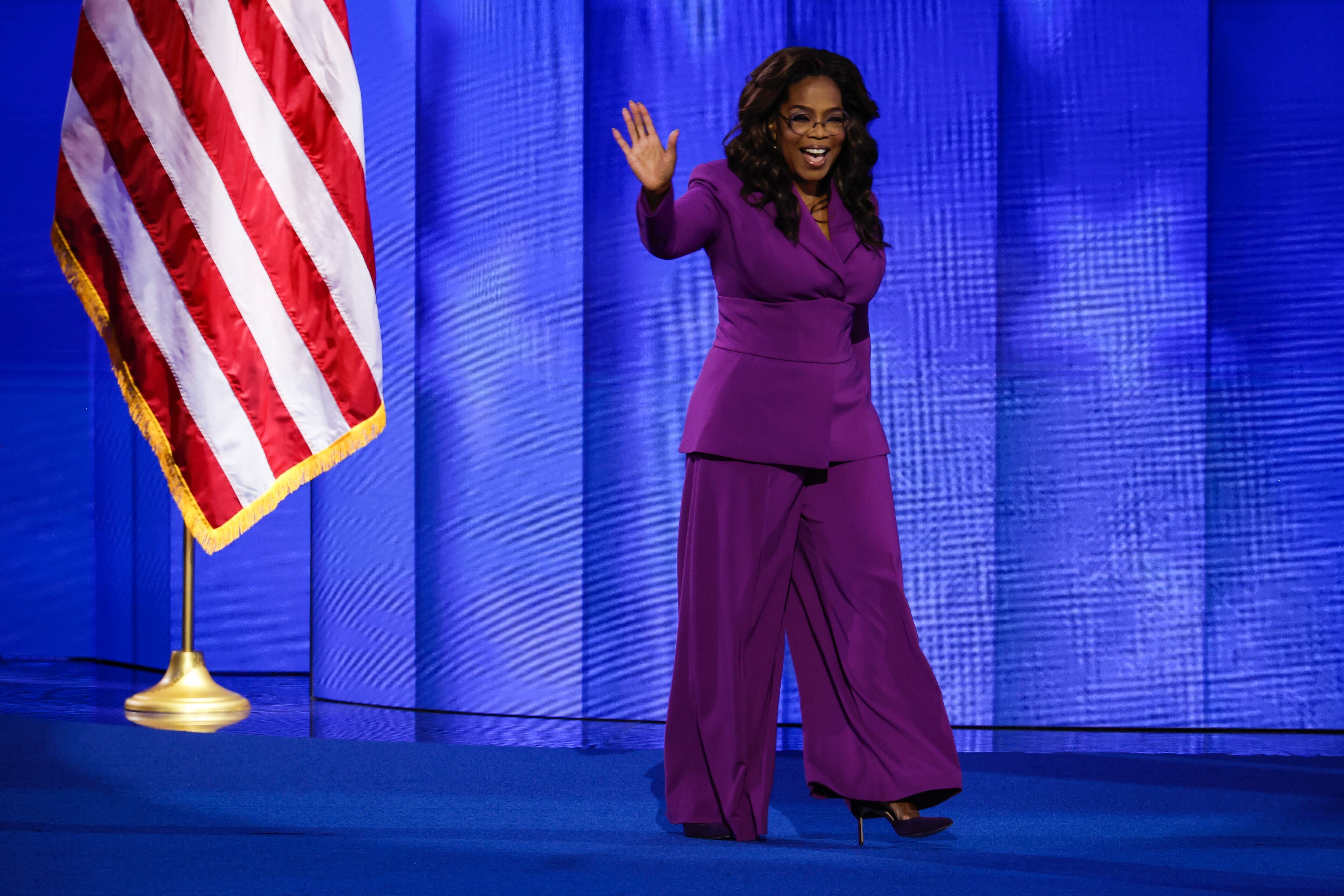 Talk show host Oprah Winfrey arrives to speak on stage during the third day of the Democratic National Convention in Chicago. Winfrey wore an ensemble designed by Annapolis-native Christian Siriano.