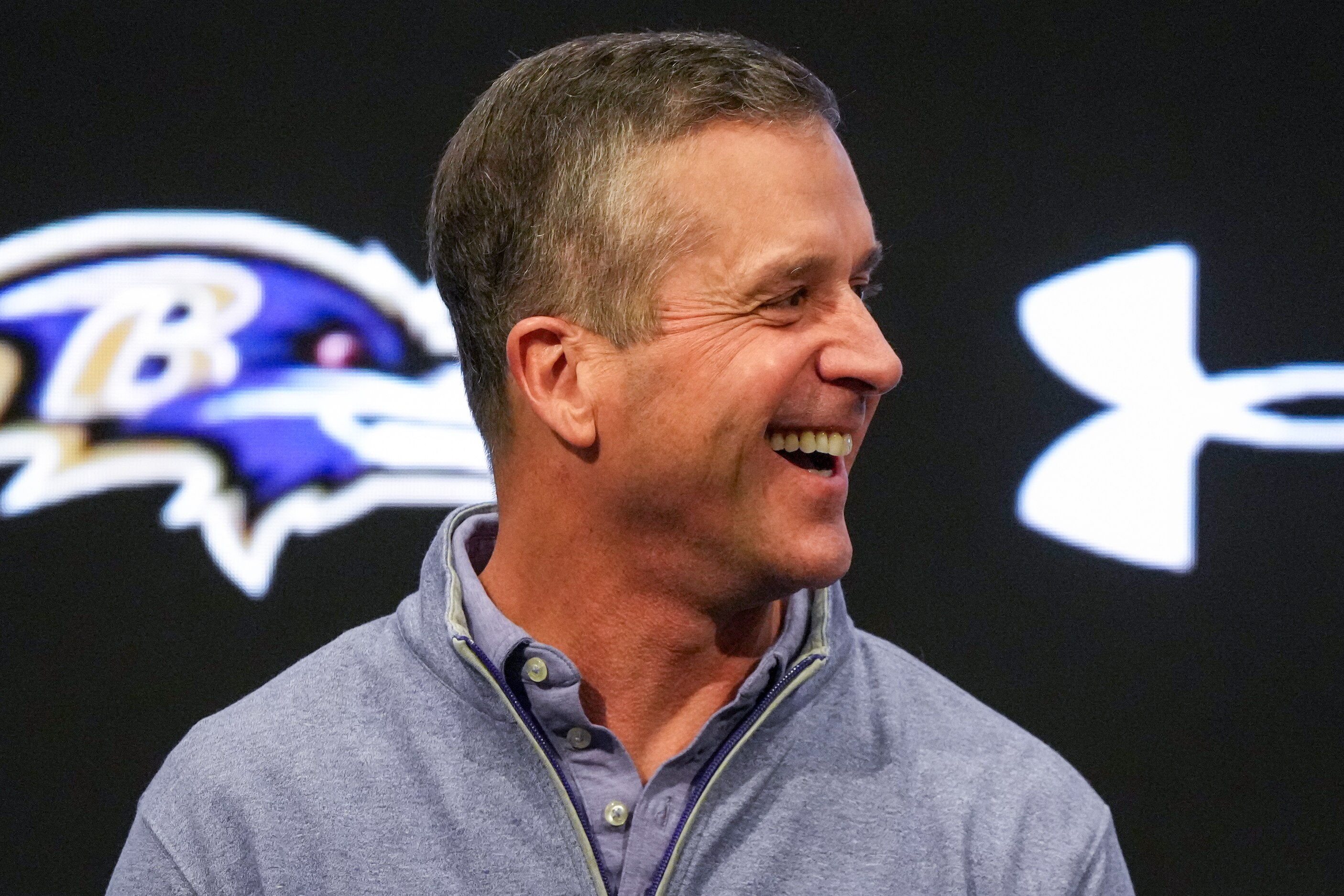 Baltimore Ravens Head Coach John Harbaugh laughs during a news conference at the Under Armour Performance Center in Owings Mills on Thursday, March 14.