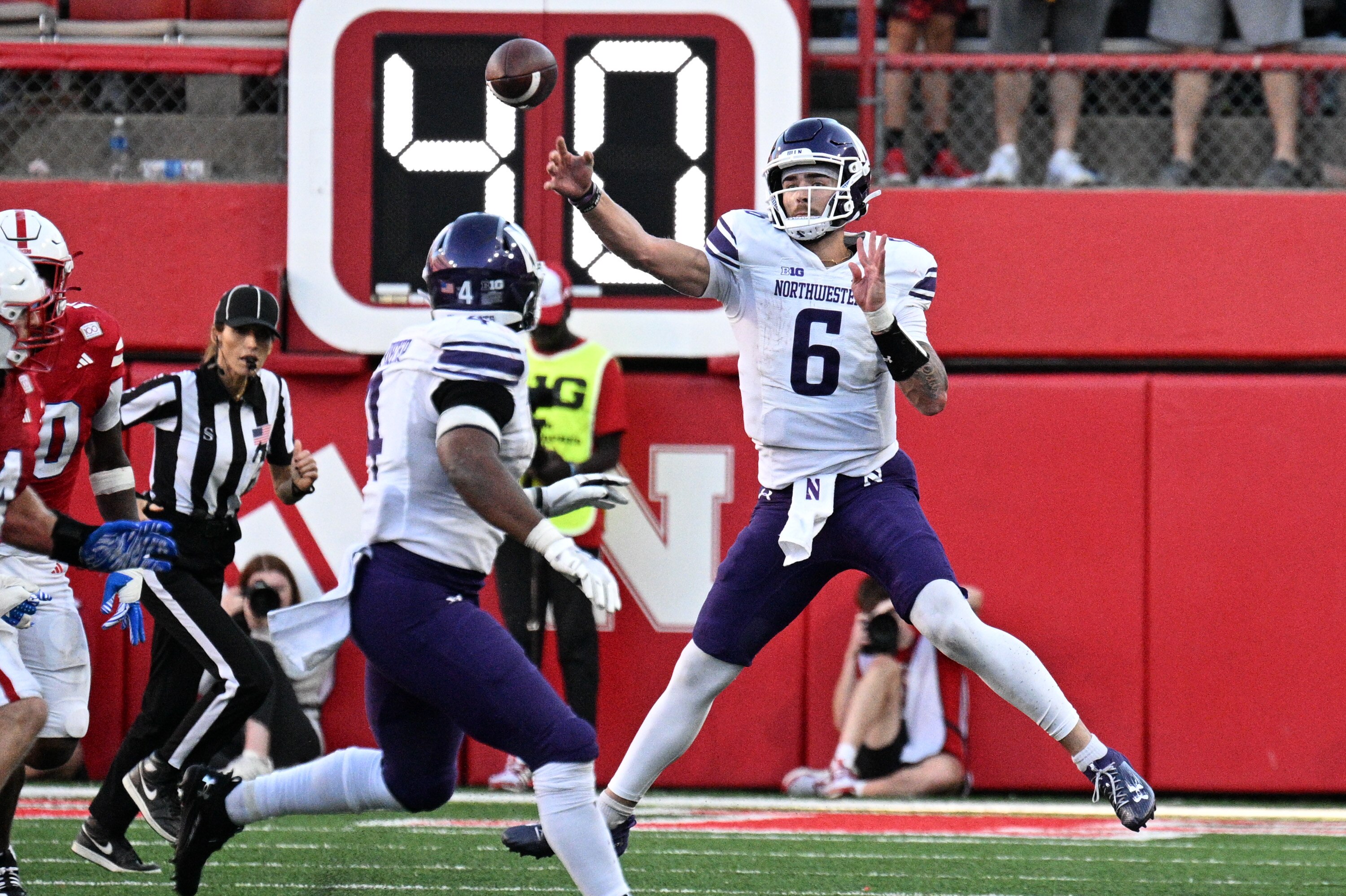 Northwestern quarterback Brendan Sullivan, pictured against Nebraska, threw for 265 yards and ran for 56 to lead the Wildcats over Maryland.