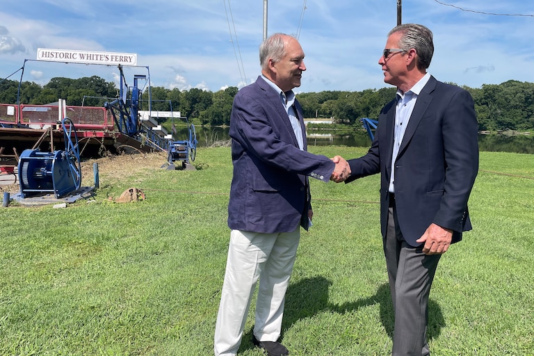 County Executive Marc Elrich, left, and Chuck Kuhn shake hands after announcing a $1.5 million deal for Montgomery County to acquire White's Ferry.