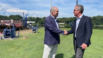 County Executive Marc Elrich, left, and Chuck Kuhn shake hands after announcing a $1.5 million deal for Montgomery County to acquire White's Ferry.