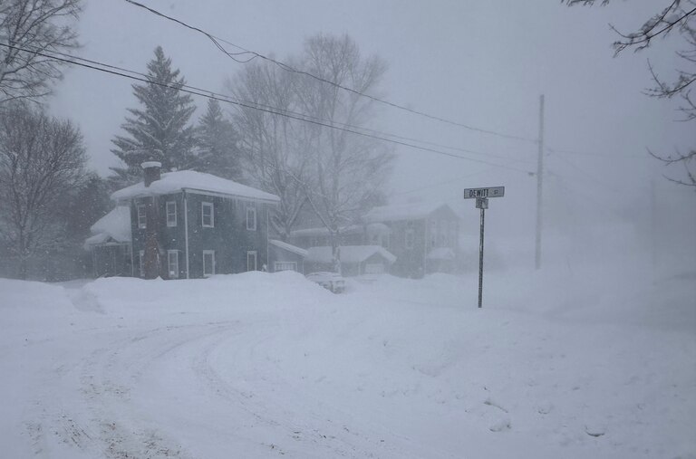 Strong winds kick up snow in Lowville, New York, on Friday, Jan. 23, 2026. (AP Photo/Cara Anna)