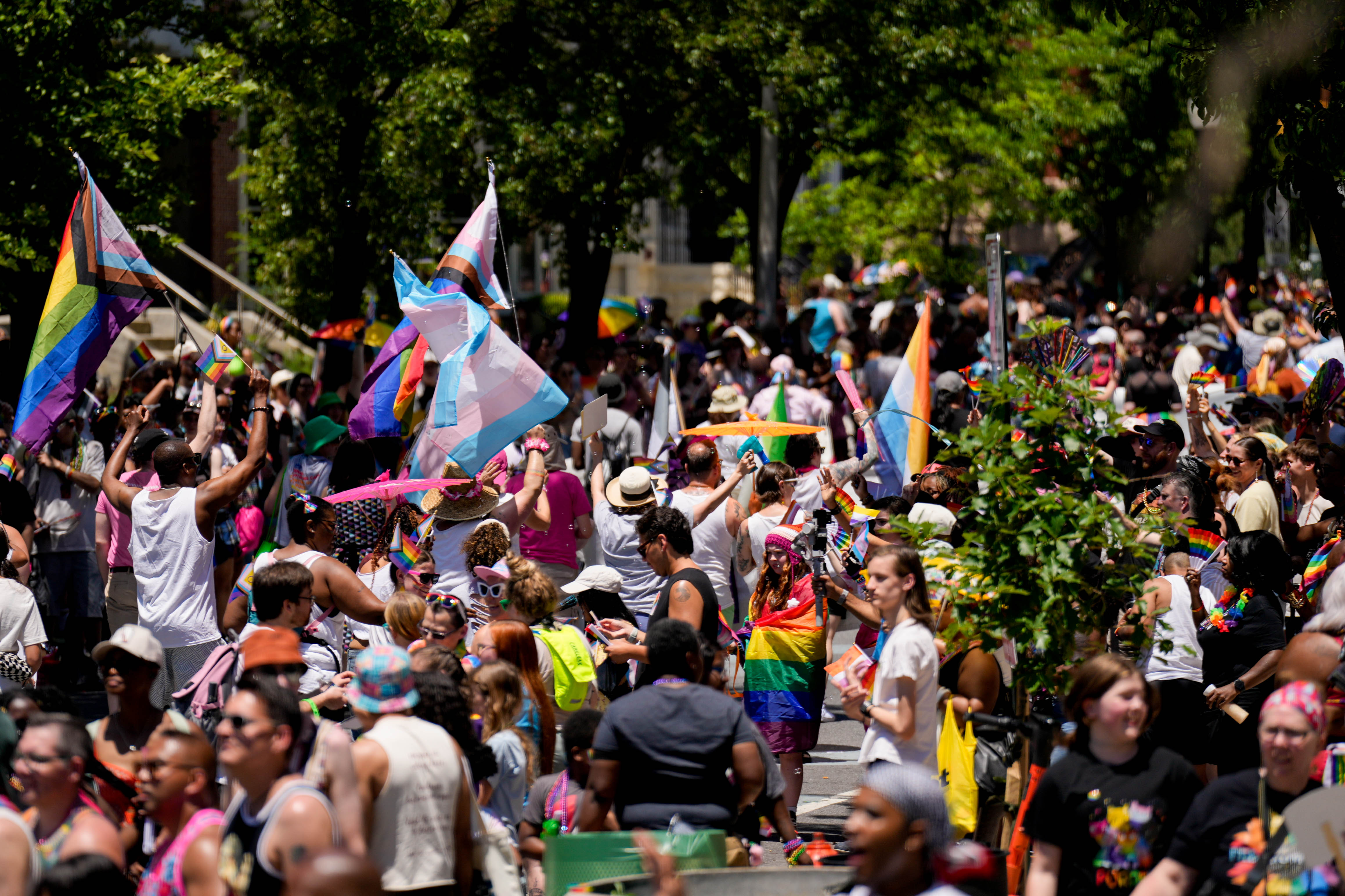 Thousands took to Charles Street to march in the Baltimore Pride parade or watch from the sidewalks Saturday. In the Hampden neighborhood, though, a bookstore’s Pride display was vandalized.