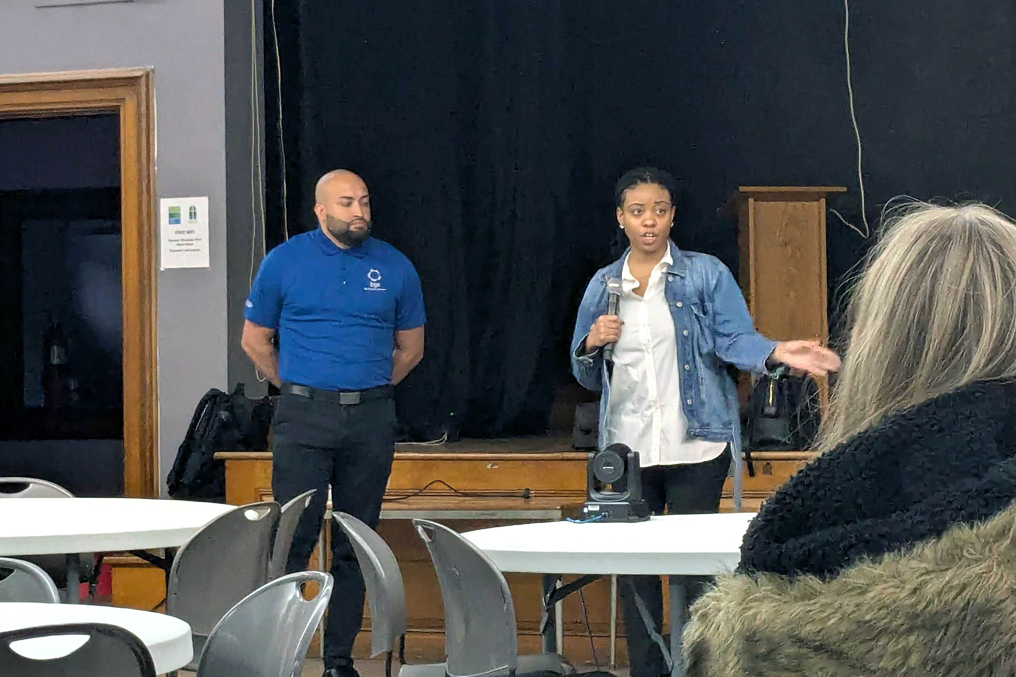 Monday, March 30, 2026 - Cristiano Quijano, an energy assistance and community engagement manager for BGE, and Lineta Duren, a community engagement manager for BGE, speak at a meeting with the Riverside Neighborhood Association at Salem Lutheran Church in Baltimore.