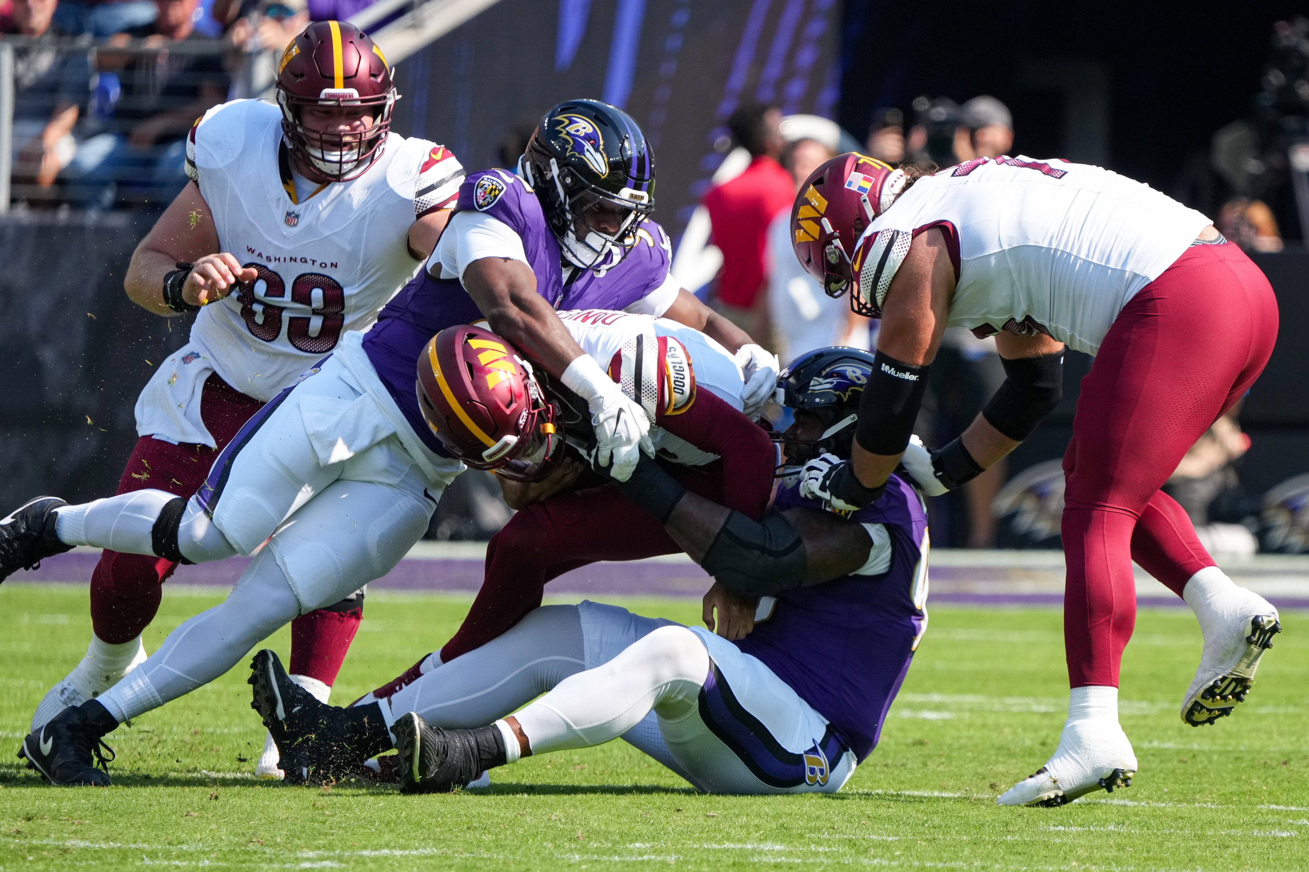 Ravens defensive tackles Travis Jones and Nnamdi Madubuike sack the Commanders’ Jayden Daniels. The defensive tackles are the backbone of the NFL’s best run defense.