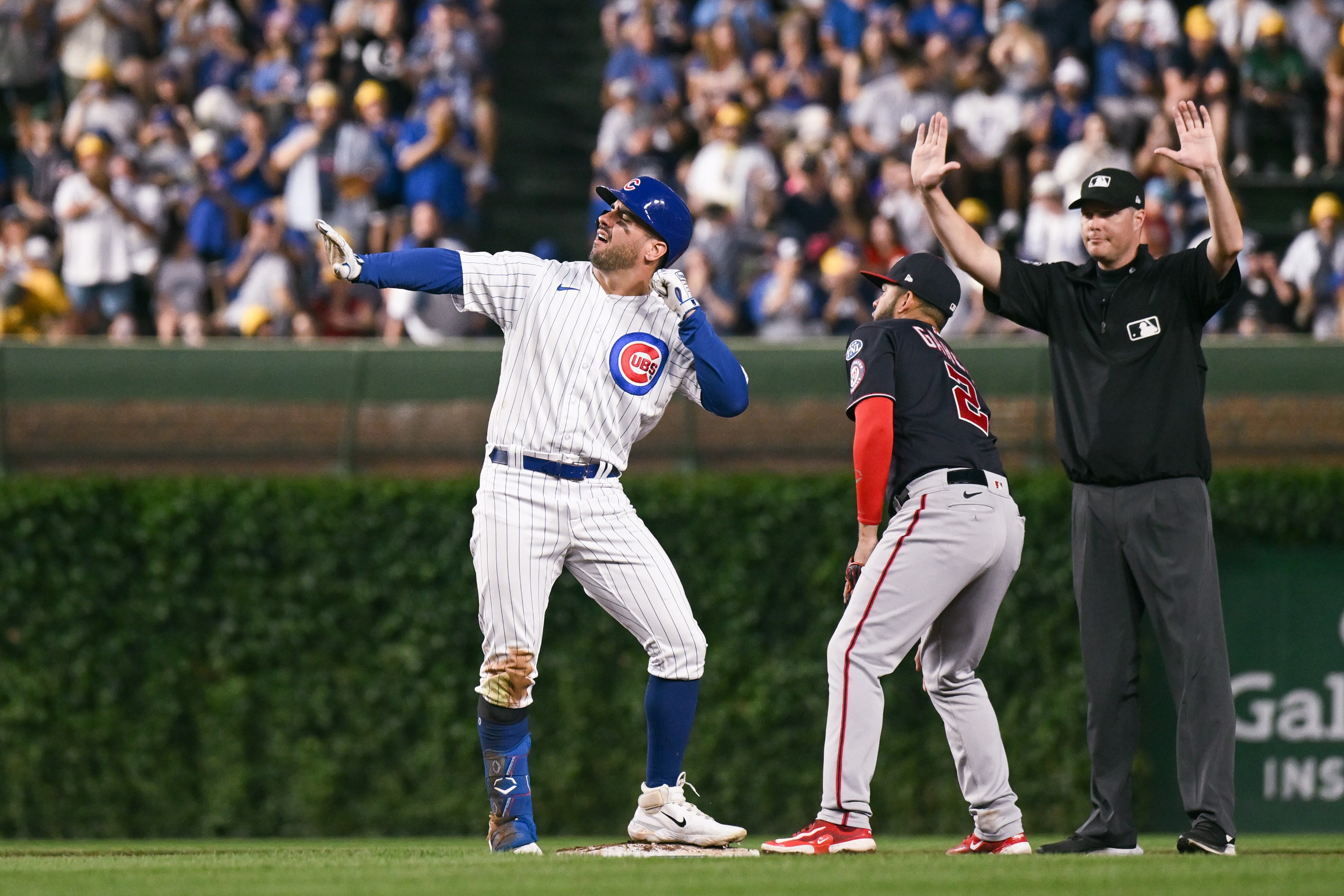 Mike Tauchman plays to the Cubs dugout after driving in a run with a fourth-inning double.