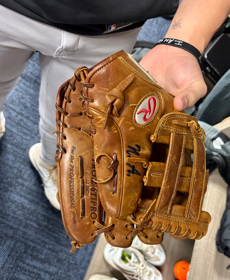 Jackson Holliday received 10-time Gold Glove winner Nolan Arenado's old glove in the mail from his parents. He isn't using it in the game, but "it's fun" to have as Holliday adapts to playing third base.
