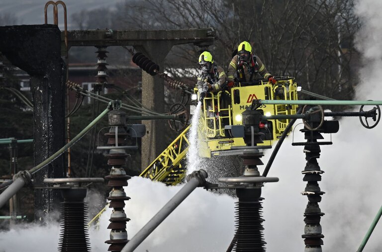 Members of the Fire Brigade attend the scene following a major fire at an electrical substation at Heathrow on March 21, 2025 in London, England.