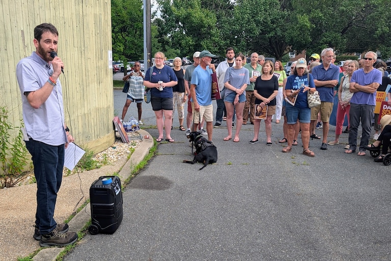 Dan Schwartz, the Democratic candidate for Congress in Maryland's 1st District, talks to a group of about 75 supporters July 22, 2026 on Kent Island. He was outside the closed district offices of his opponent, Rep. Andy Harris.