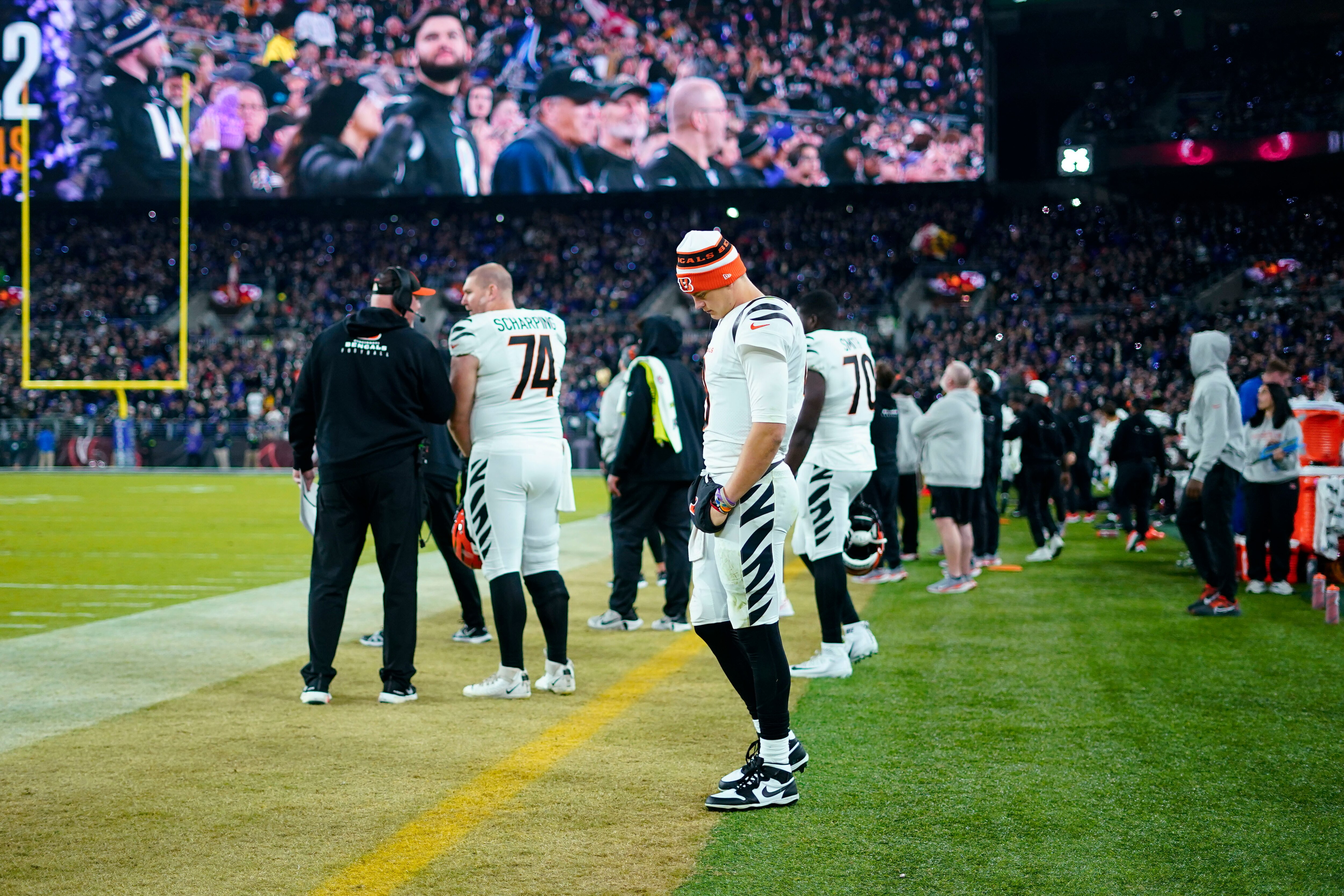 Cincinnati Bengals quarterback Joe Burrow (9) looks down on the sideline in the second half of an NFL football game against the Baltimore Ravens in Baltimore, Thursday, Nov. 16, 2023.