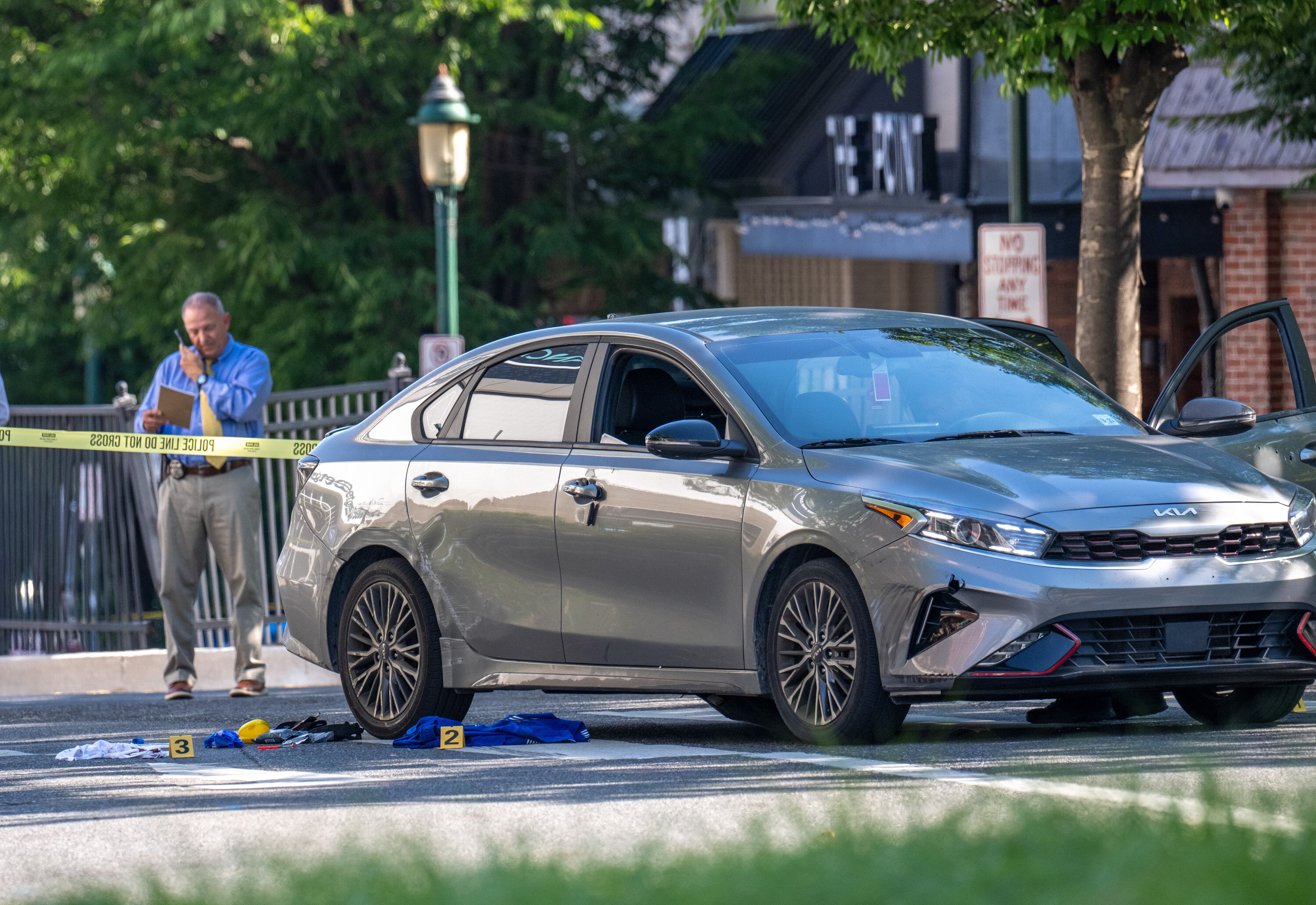 Baltimore County Police officers investigate a June 5 shooting that occurred at the traffic circle along York Road in Towson on Friday afternoon. 