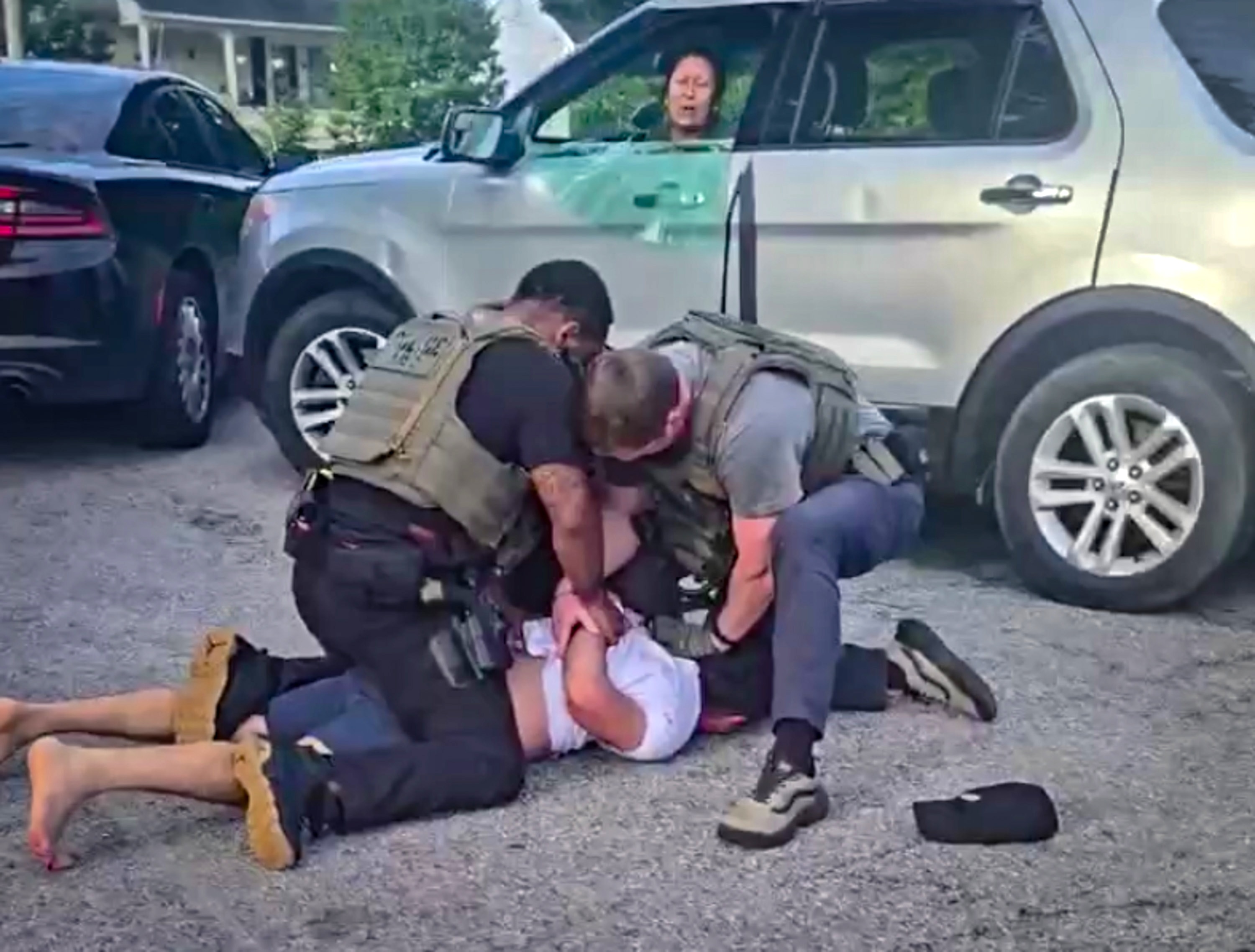 Federal immigration agents arrest Jesus Acevedo Sanchez as he drops his daughter off at Commodore John Rodgers Elementary/Middle School in June as his partner, Adriana Gavilan Sanchez, the girl’s mother, looks on. (Still from bystander video)