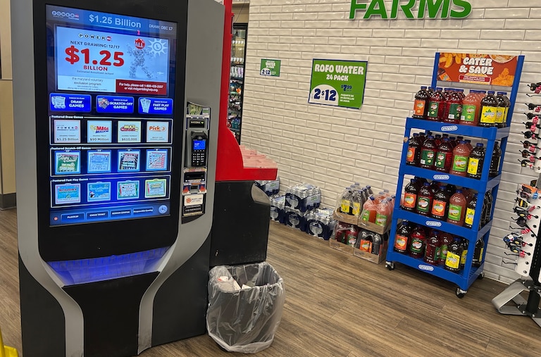 A self-automated lottery machine at a Royal Farms on Light Street in Baltimore displays the $1.25 billion jackpot for the drawing Wednesday, Dec. 17, 2025.