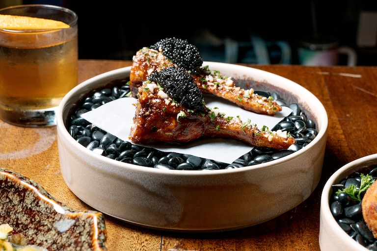 Shiitake stuffed chicken wings finished with Ostera caviar are also offered at Nest at 21 North Eutaw Street.