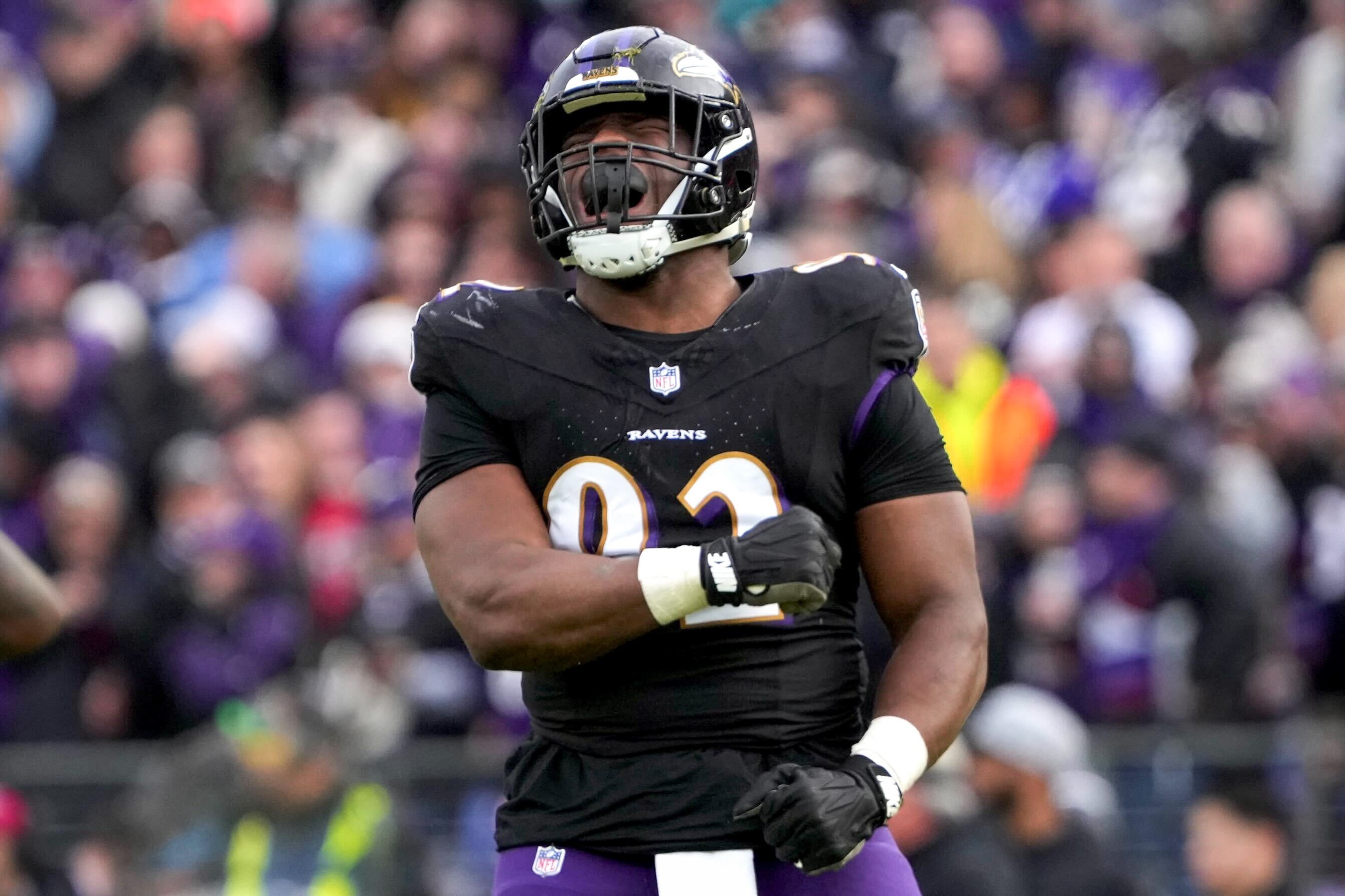 Baltimore Ravens defensive tackle Justin Madubuike (92) celebrates after sacking Miami Dolphins quarterback Tua Tagovailoa at M&T Bank Stadium on Sunday, Dec. 31, 2023. The Ravens won, 56-19, to secure the best record in the AFC.