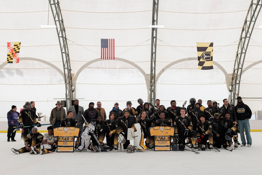 The Baltimore Banners ice hockey team poses for a photo at the Rink Rally event at the Mimi DiPietro Skating Center.