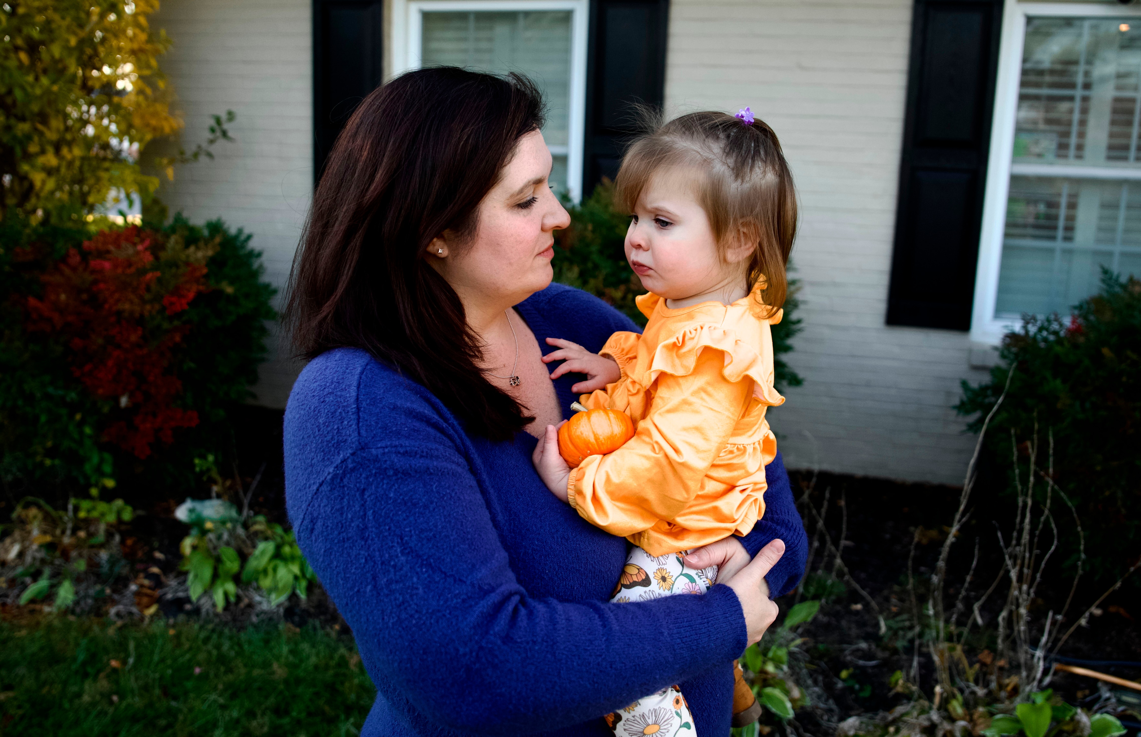Lana Jo Hill plays with her daughter Violet on Nov. 3, 2023. Violet’s day care was recently vandalized and is temporarily closed, leaving her parents to come up with an alternative for daytime care.