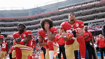 FILE - In this Oct. 2, 2016, file photo, from left, San Francisco 49ers outside linebacker Eli Harold, quarterback Colin Kaepernick and safety Eric Reid kneel during the national anthem before an NFL football game against the Dallas Cowboys in Santa Clara, Calif. (AP Photo/Marcio Jose Sanchez, File)