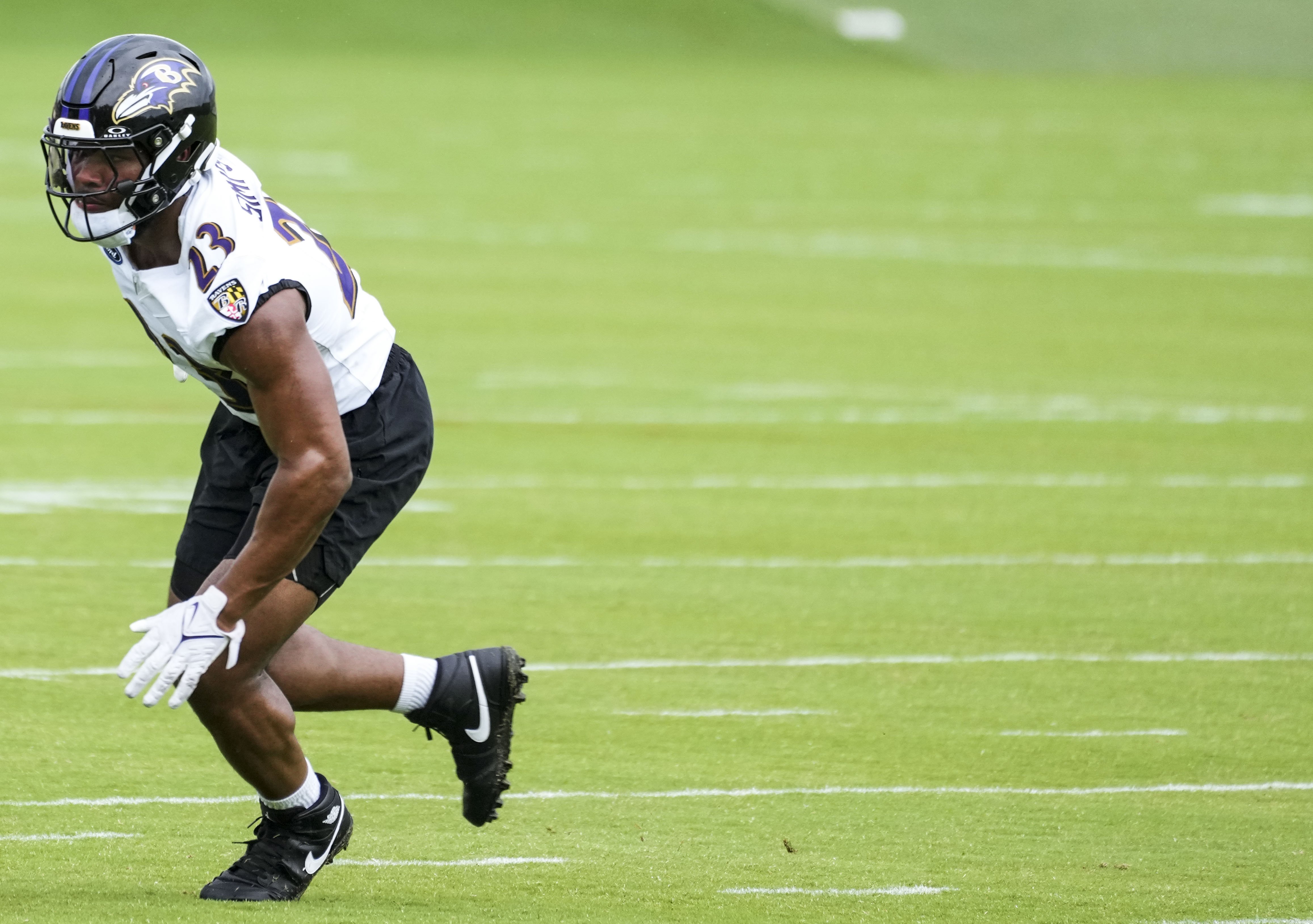 Baltimore Ravens linebacker Trenton Simpson runs a drill during practice at the Under Armour Performance Center on May 23.