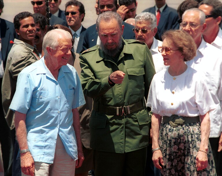 405512 03: Cuban leader Fidel Castro (C) speaks with the former U.S. President Jimmy Carter (L) and his wife Rosalyn during a departure ceremony at Jose Marti International airport May 17, 2002 in Havana, Cuba. Carter visited for six days in an effort to improve relations between the U.S. and Cuba.