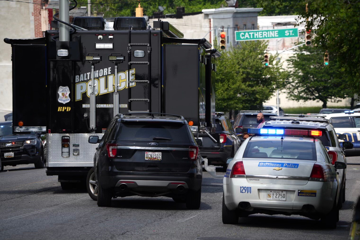 Police respond to reports of a shooting at the corner of S Catherine St. & Frederick Ave. on May 11, 2023.