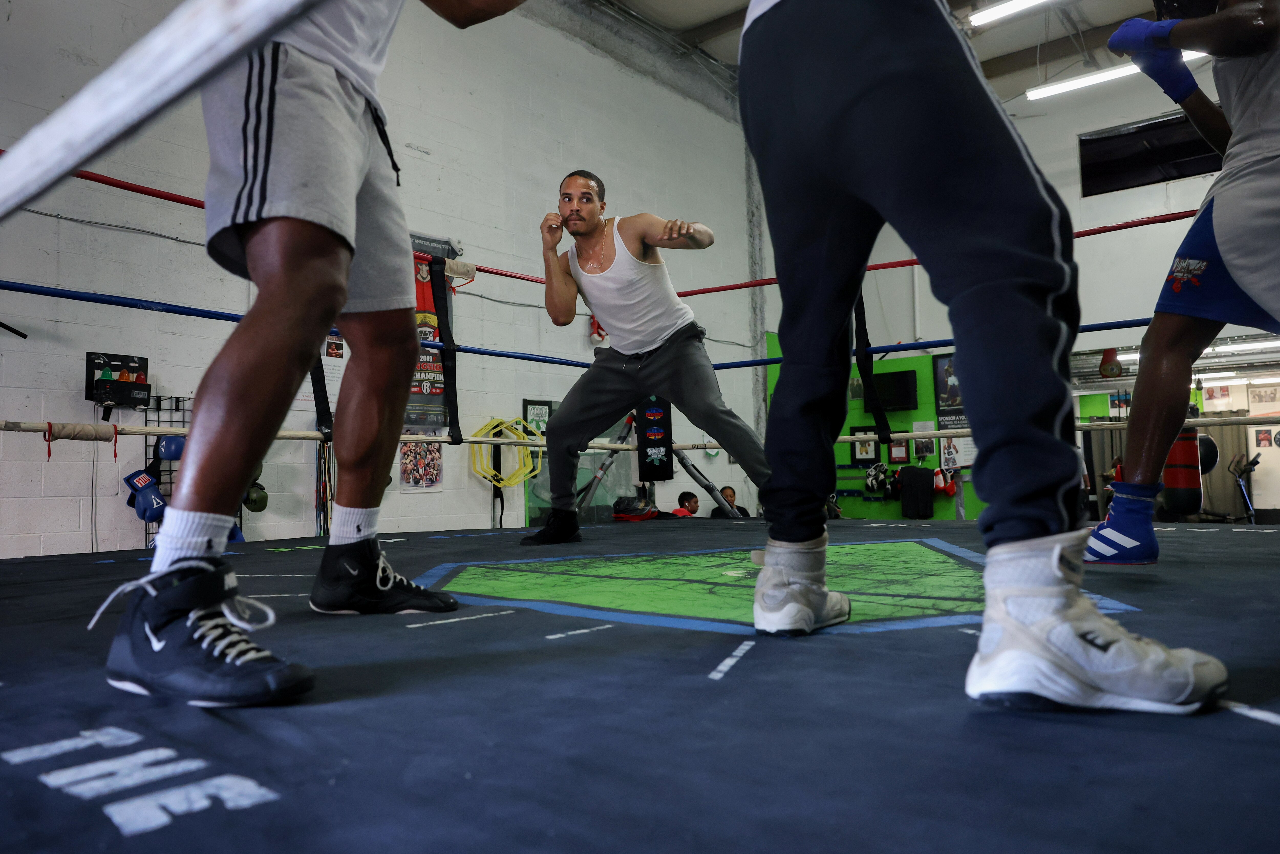 Yran Butler, 26, does shadow boxing drills with fellow boxers during training at Diamond N' the Ruff boxing gym in Forestville, MD, U.S., August 5, 2026. Leah Millis for the Baltimore Banner