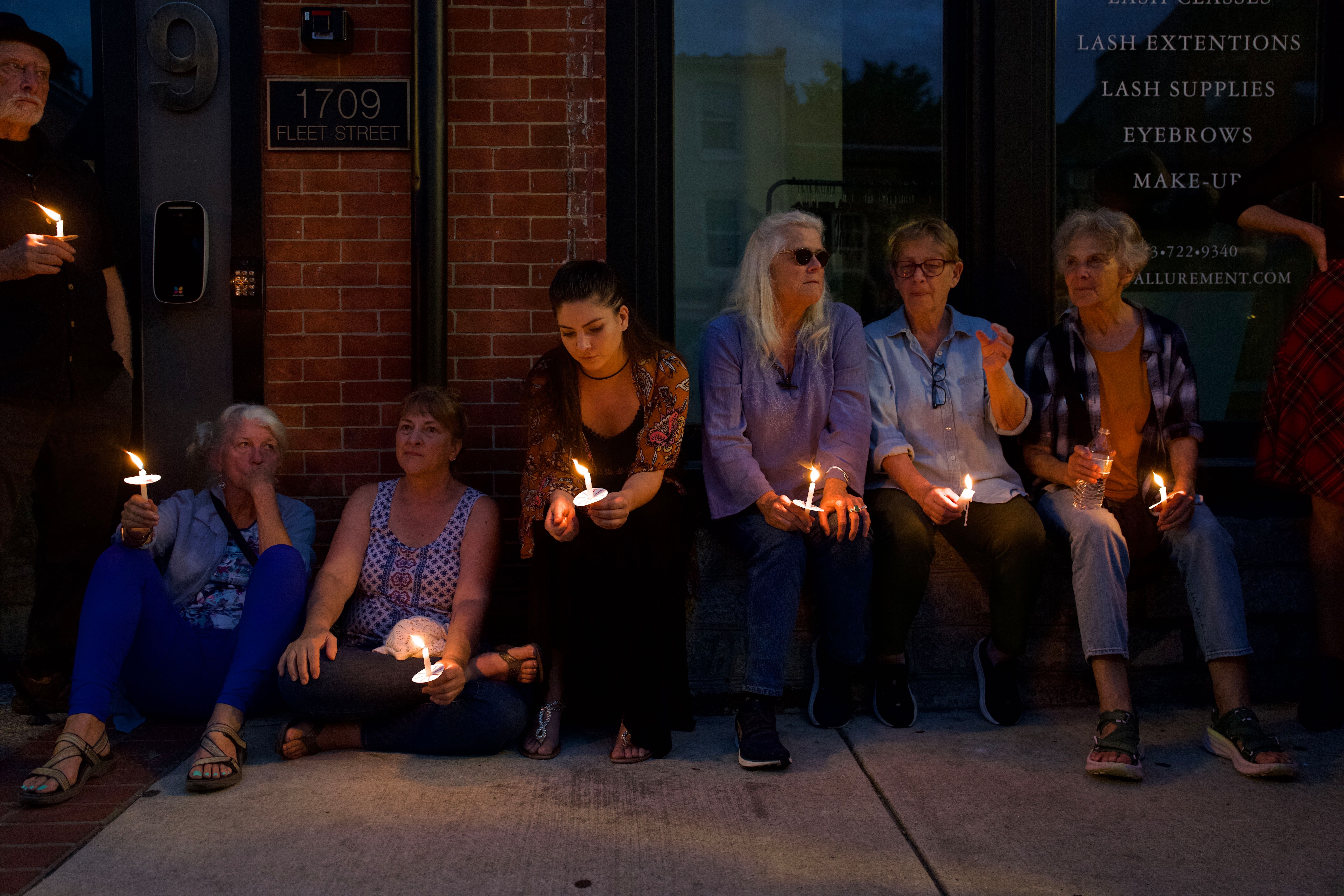 The Fells Point community holds an evening vigil on Thursday for Claudia Bismark, who died just two days after she and her partner were assaulted and robbed in Fells Point