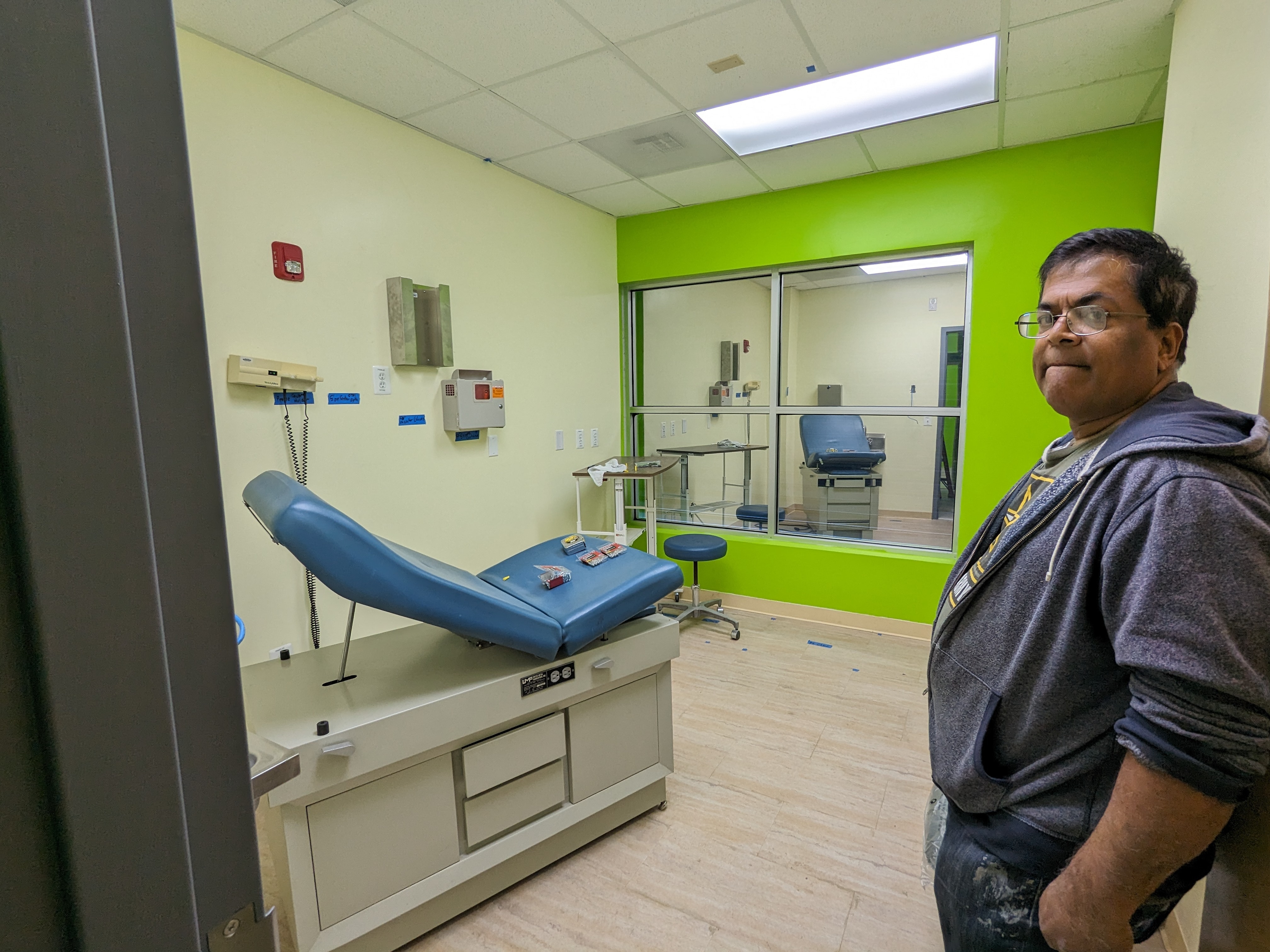 Dr. Devesh Kanjarpane shows a room at Charm City Health Center in April 2024.