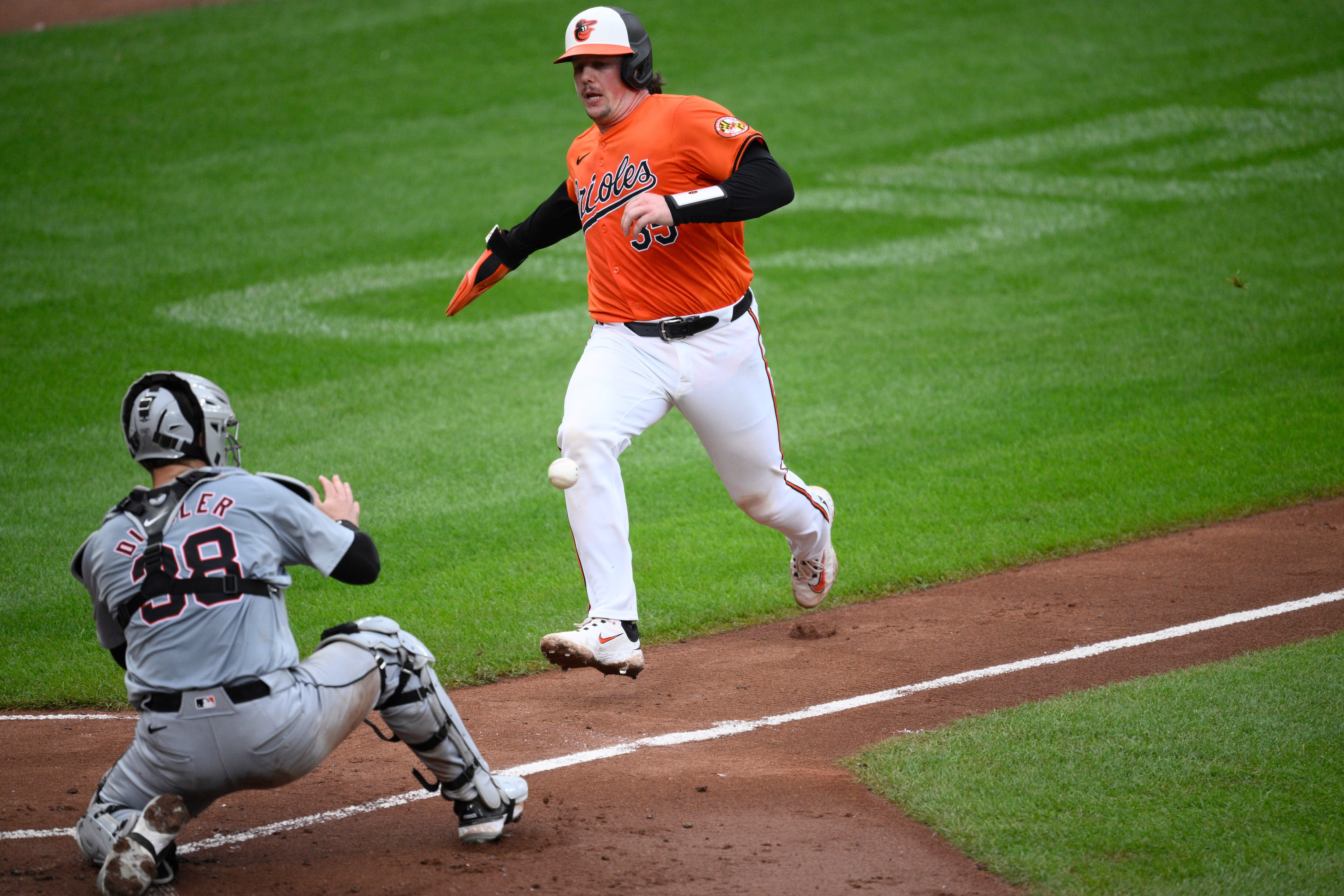 The Orioles’ Adley Rutschman can’t beat the throw home on a single by Heston Kjerstad in the fourth inning. Tigers catcher Dillon Dingler fields the ball before tagging Rutschman out.
