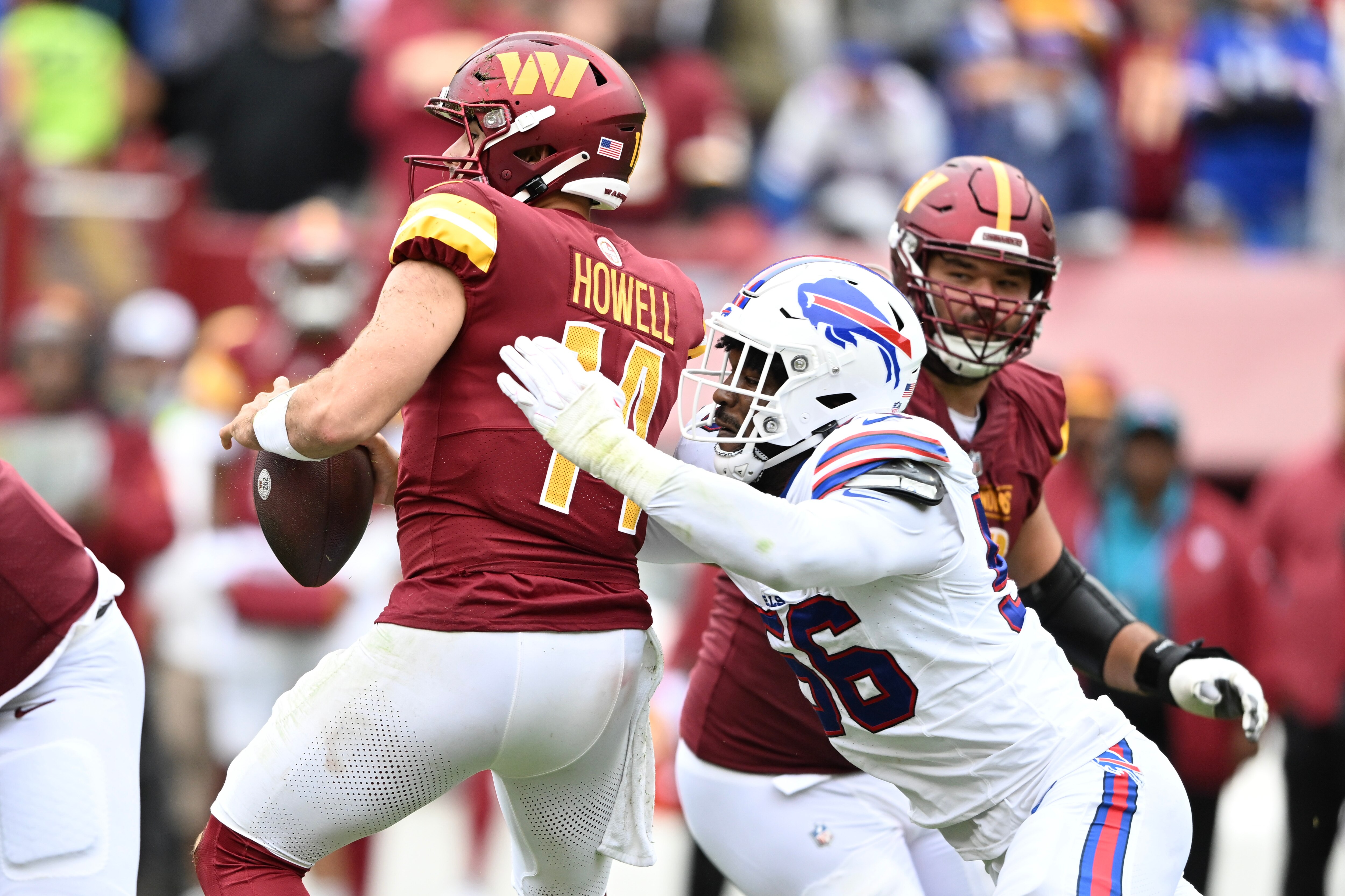 LANDOVER, MARYLAND - SEPTEMBER 24: Leonard Floyd #56 of the Buffalo Bills sacks Sam Howell #14 of the Washington Commanders during the third quarter of a game at FedExField on September 24, 2023 in Landover, Maryland. (Photo by Greg Fiume/Getty Images)